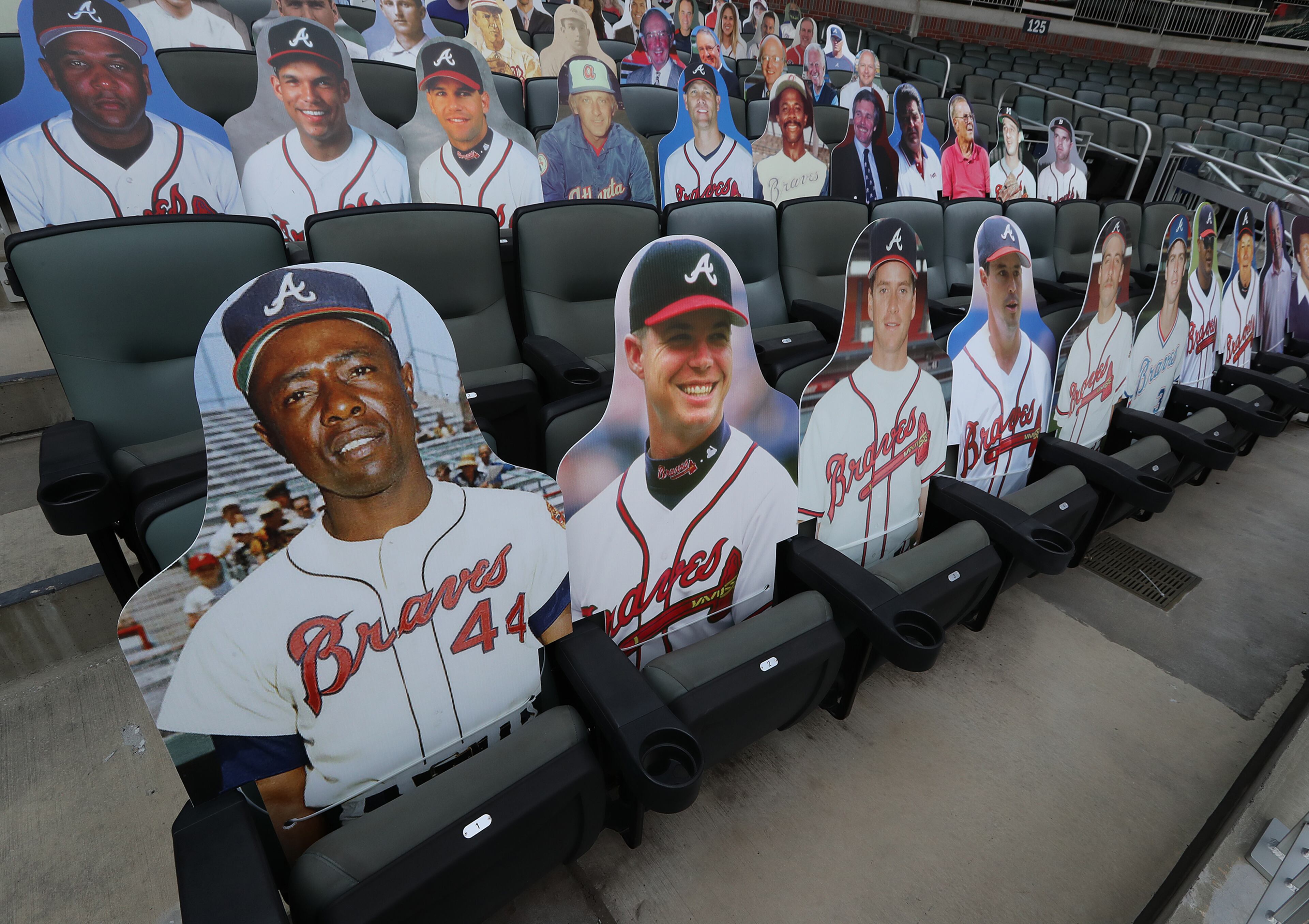 New fan cutouts Hank Aaron (from left), Chipper Jones, Tom Glavine, Greg Maddux, John Smoltz, Dale Murphy, Andrew Jones, Bobby Cox, and John Schuerholz are seen in the seats before the Atlanta Braves play the Washington Nationals in a MLB baseball game on Monday, August 17, 2020 in Atlanta. Curtis Compton ccompton@ajc.com