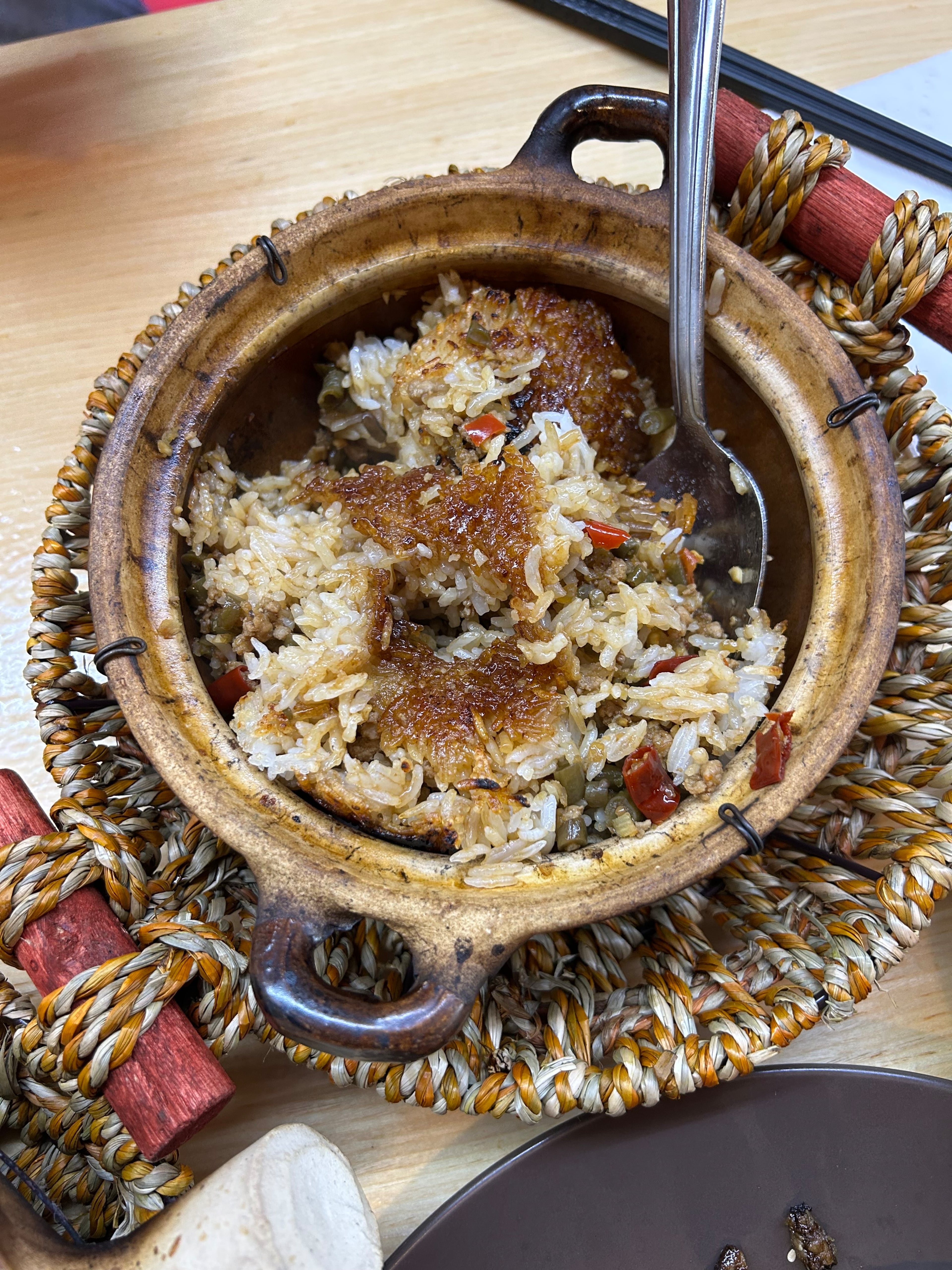 Irritable Claypot's spicy chili bean and pork claypot rice. (Candy Hom for the AJC)