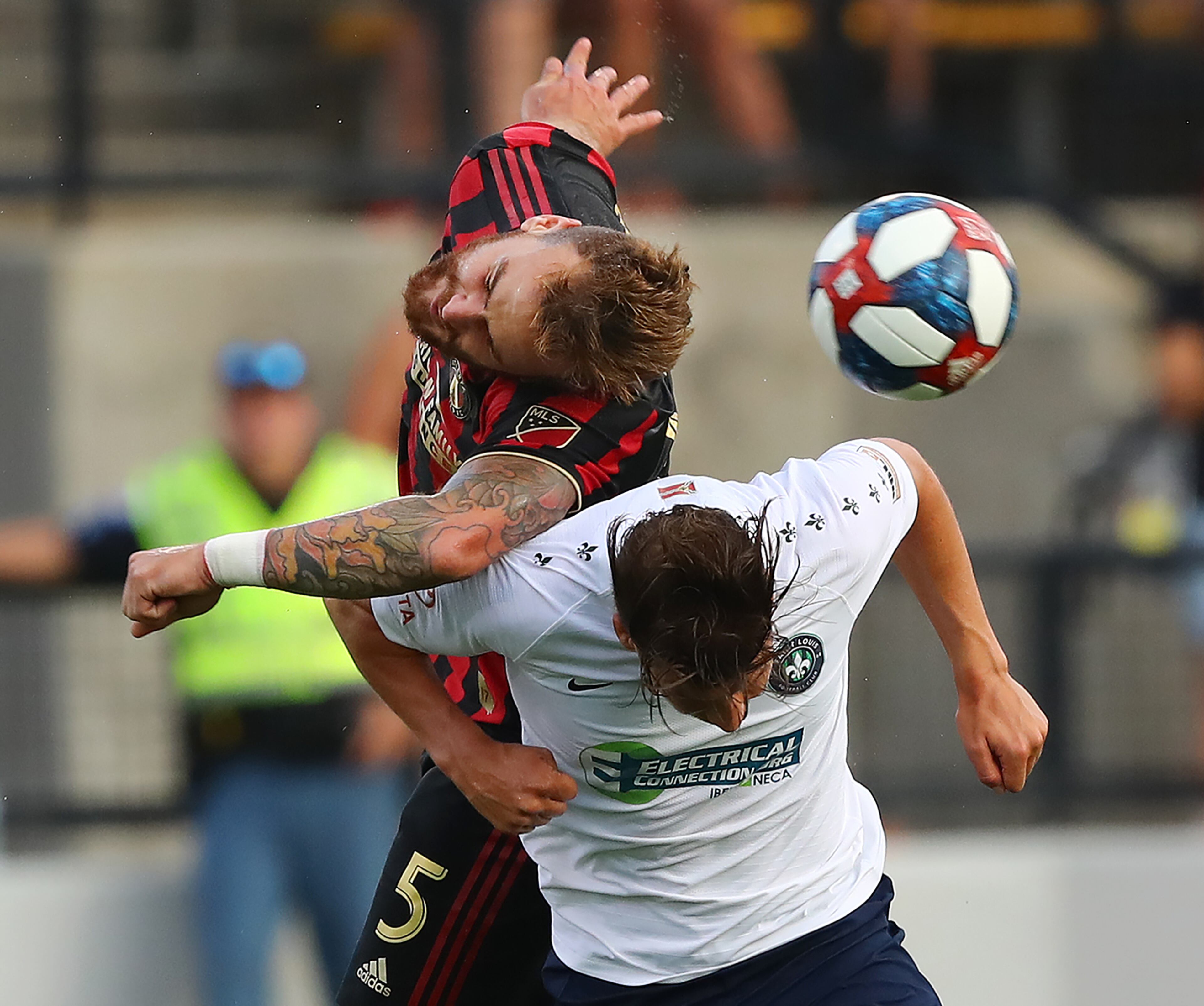 Atlanta United defender Leandro Gonzalez Pirez collides with St. Louis forward Russell Cicerone as they battle for the ball in a U.S. Open Cup quarterfinals soccer match on Wednesday, July 10, 2019, in Kennesaw. Curtis Compton/ccompton@ajc.com