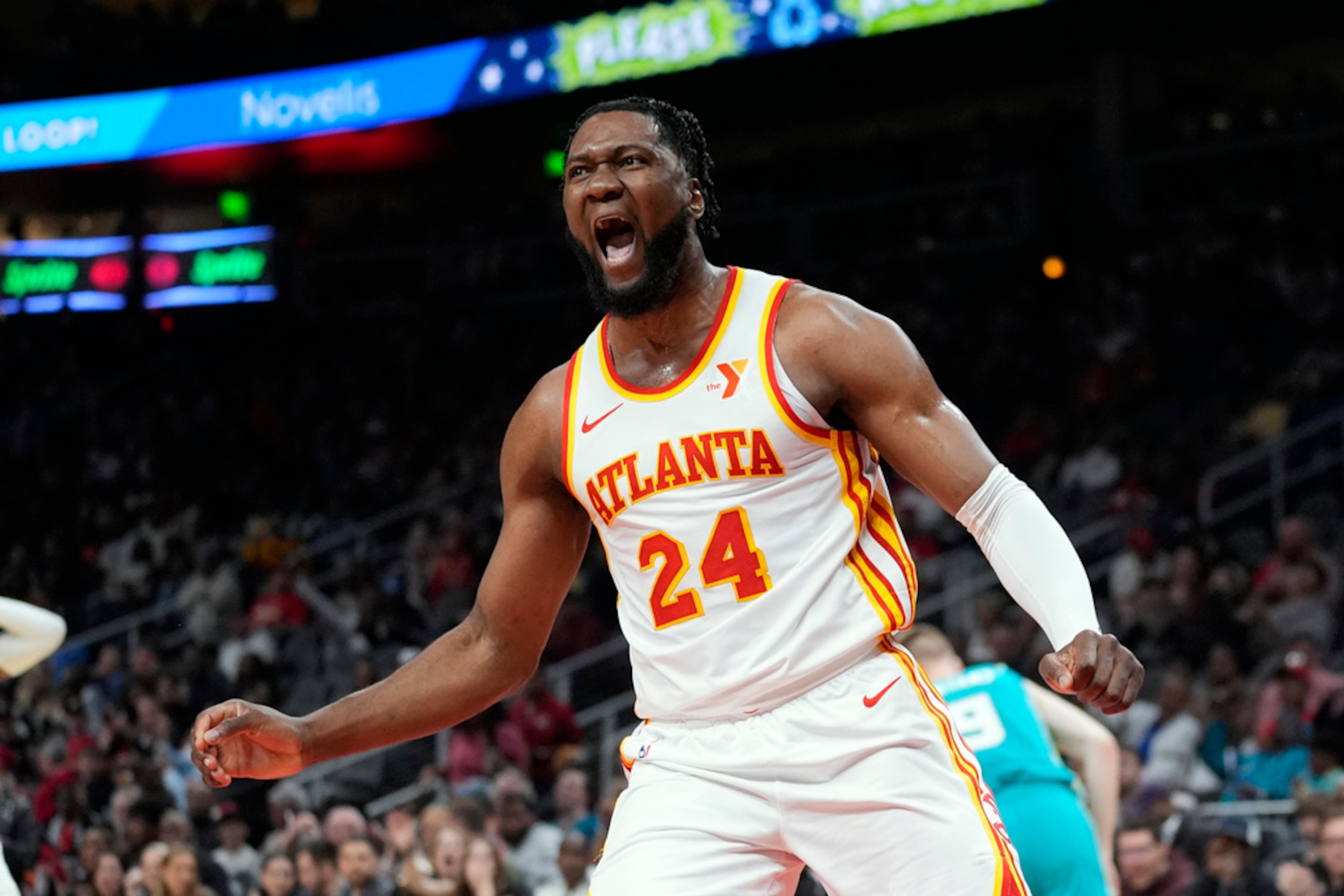 Atlanta Hawks forward Bruno Fernando (24) reacts after scoring against the Charlotte Hornets during the second half of an NBA basketball game Saturday, March 23, 2024, in Atlanta. (AP Photo/John Bazemore)