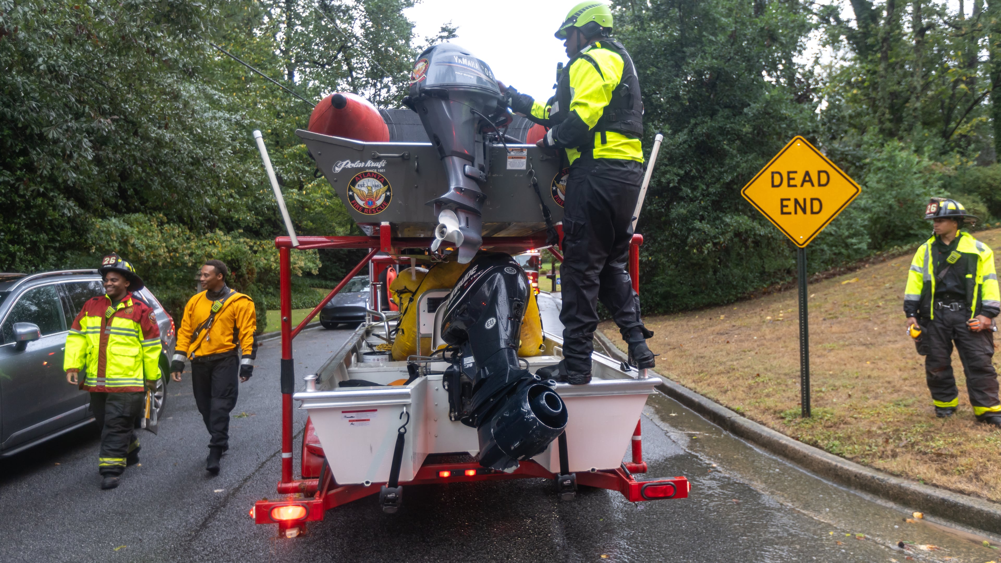 Atlanta Fire Rescue’s Dive/Swift Water Team perform welfare checks on residents on Hanover West Drive in Atlanta after Hurricane Helene, which entered Georgia as a Category 2 made landfall, September 2024. (AJC FILE)