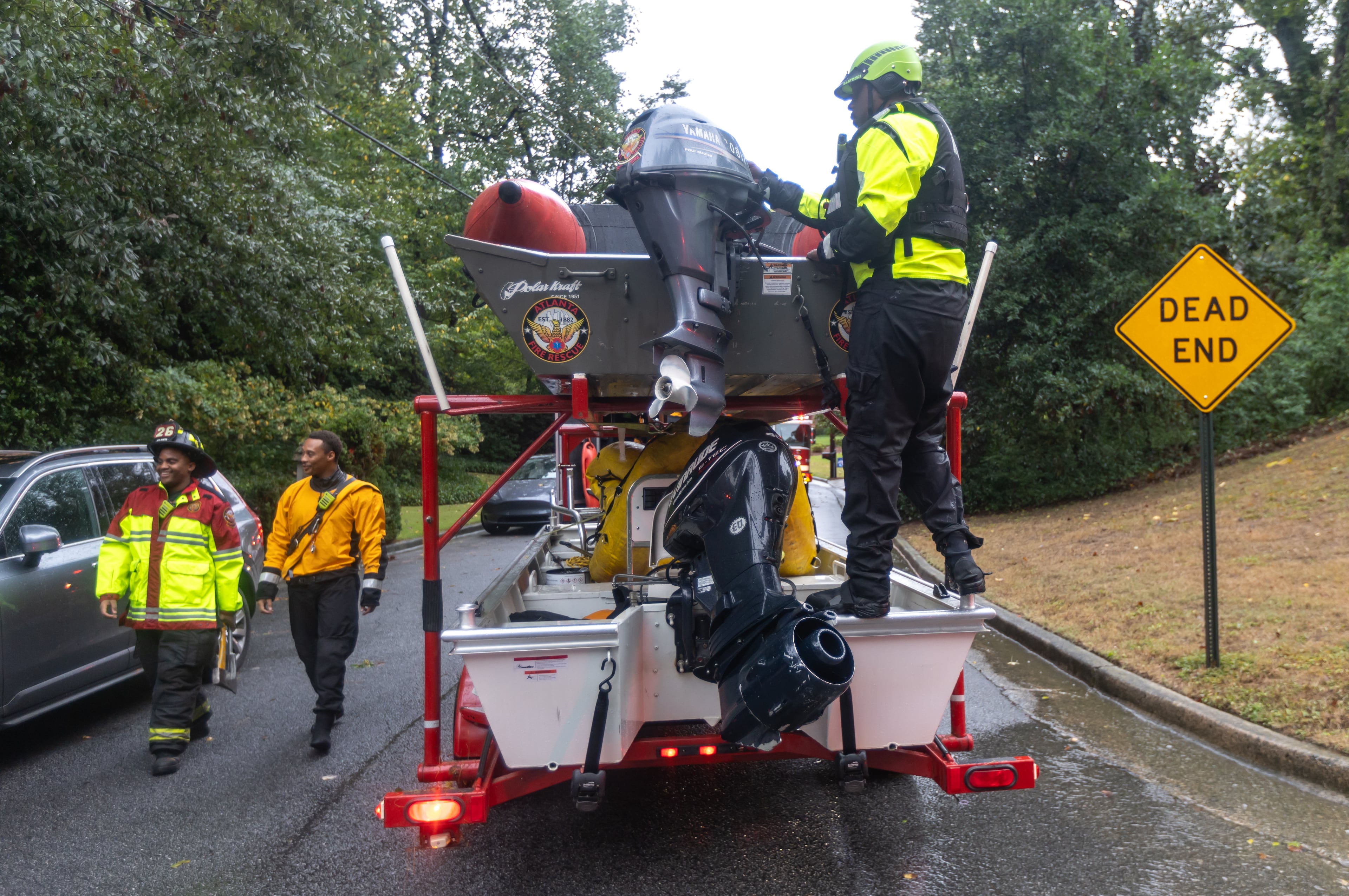 Atlanta Fire Rescue’s Dive/Swift Water Team perform welfare checks on residents on Hanover West Drive in Atlanta after Hurricane Helene, which entered Georgia as a Category 2 made landfall, September 2024. (AJC FILE)