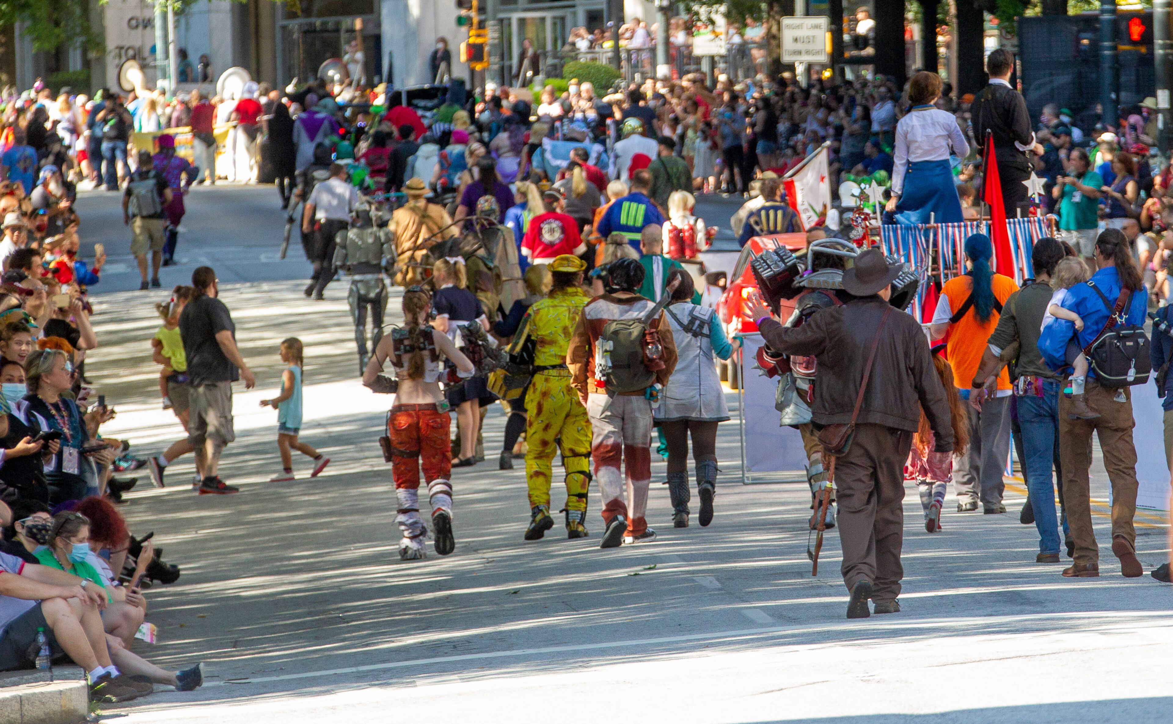 People line Peachtree Street to watch the Dragon Con Parade on Saturday, September 4, 2021, in Atlanta. STEVE SCHAEFER FOR THE ATLANTA JOURNAL-CONSTITUTION