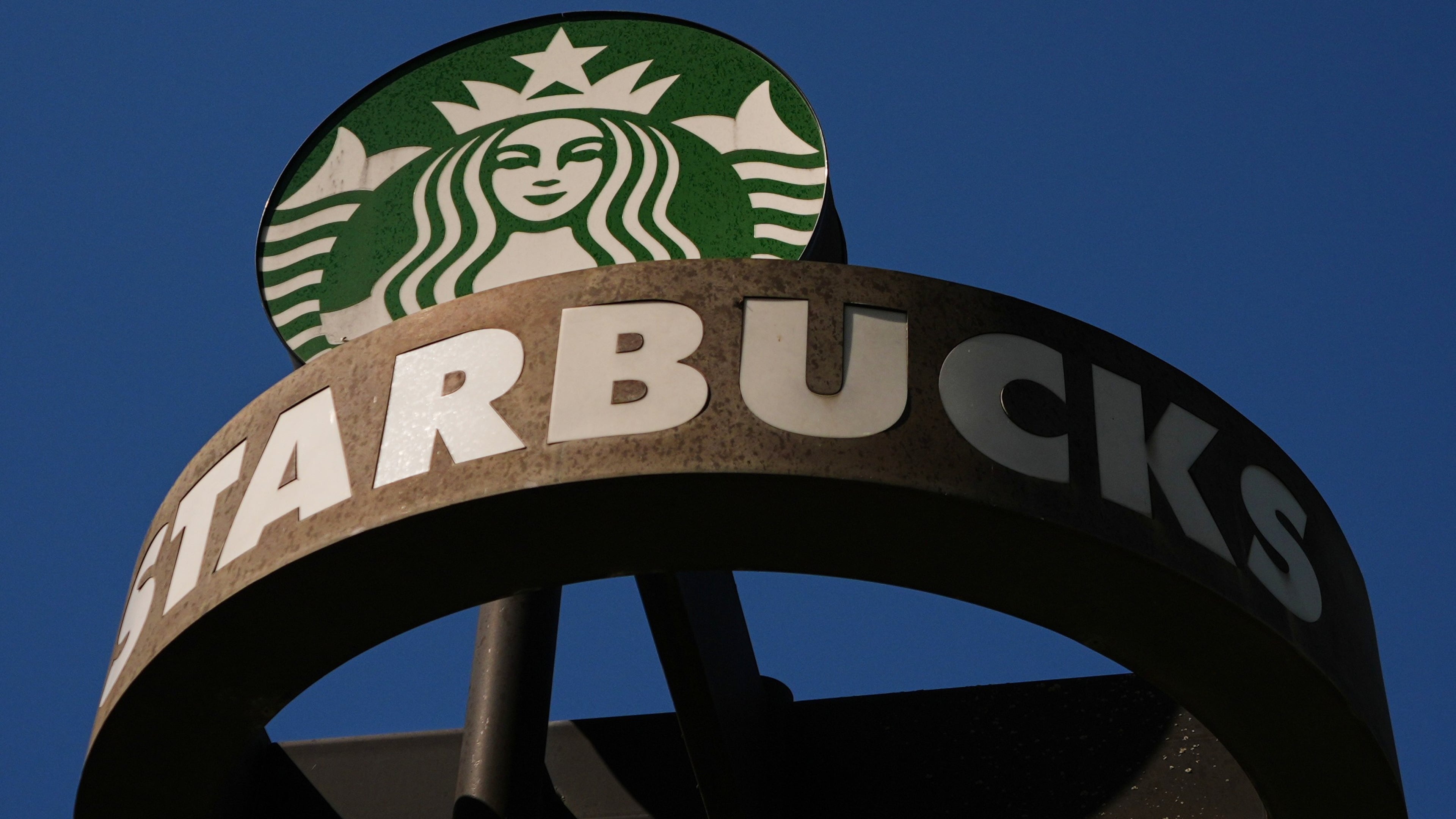 FILE - A Starbucks sign is seen outside the coffee company's global corporate headquarters, May 11, 2026, in Seattle. (AP Photo/Lindsey Wasson, File)