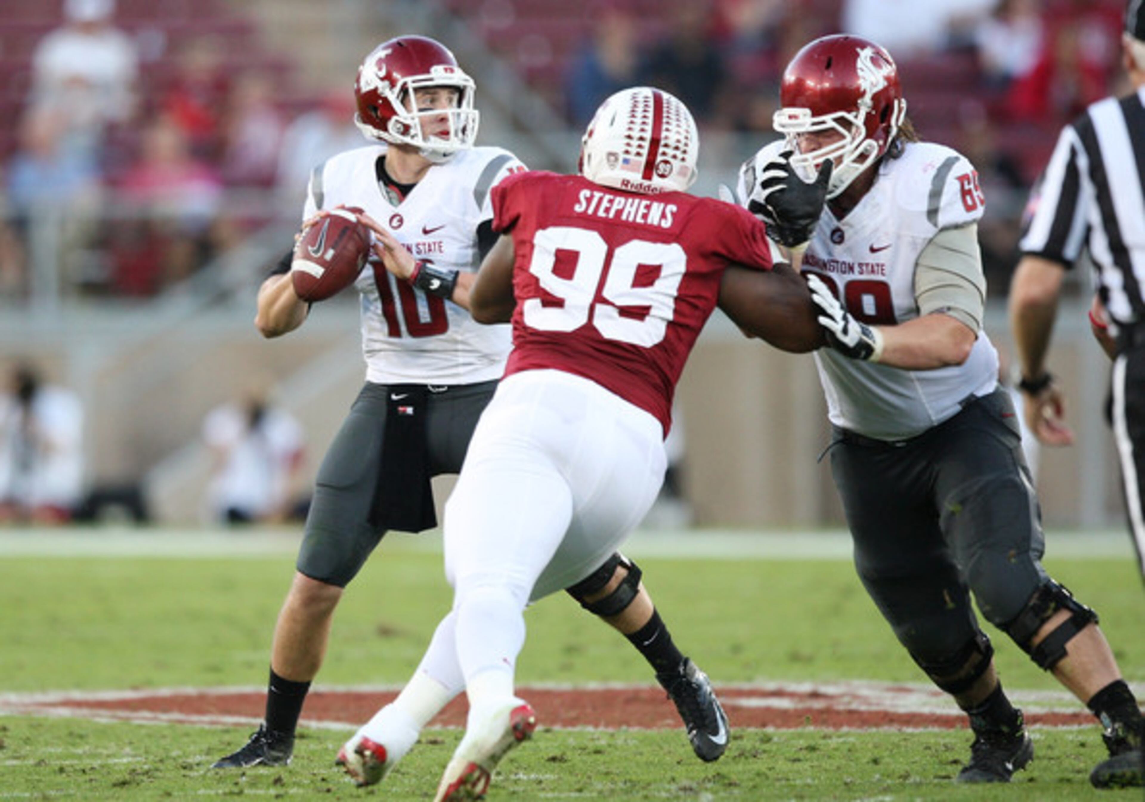 Jake Rodgers #69 of the Washington State Cougars blocks Terrence Stephens #99 of the Stanford Cardinal as Jeff Tuel #10 of the Washington State Cougars looks downfield for an open receiver at Stanford Stadium on October 27, 2012 in Palo Alto, California. (Oct. 26, 2012 - Source: Tony Medina/Getty Images North America