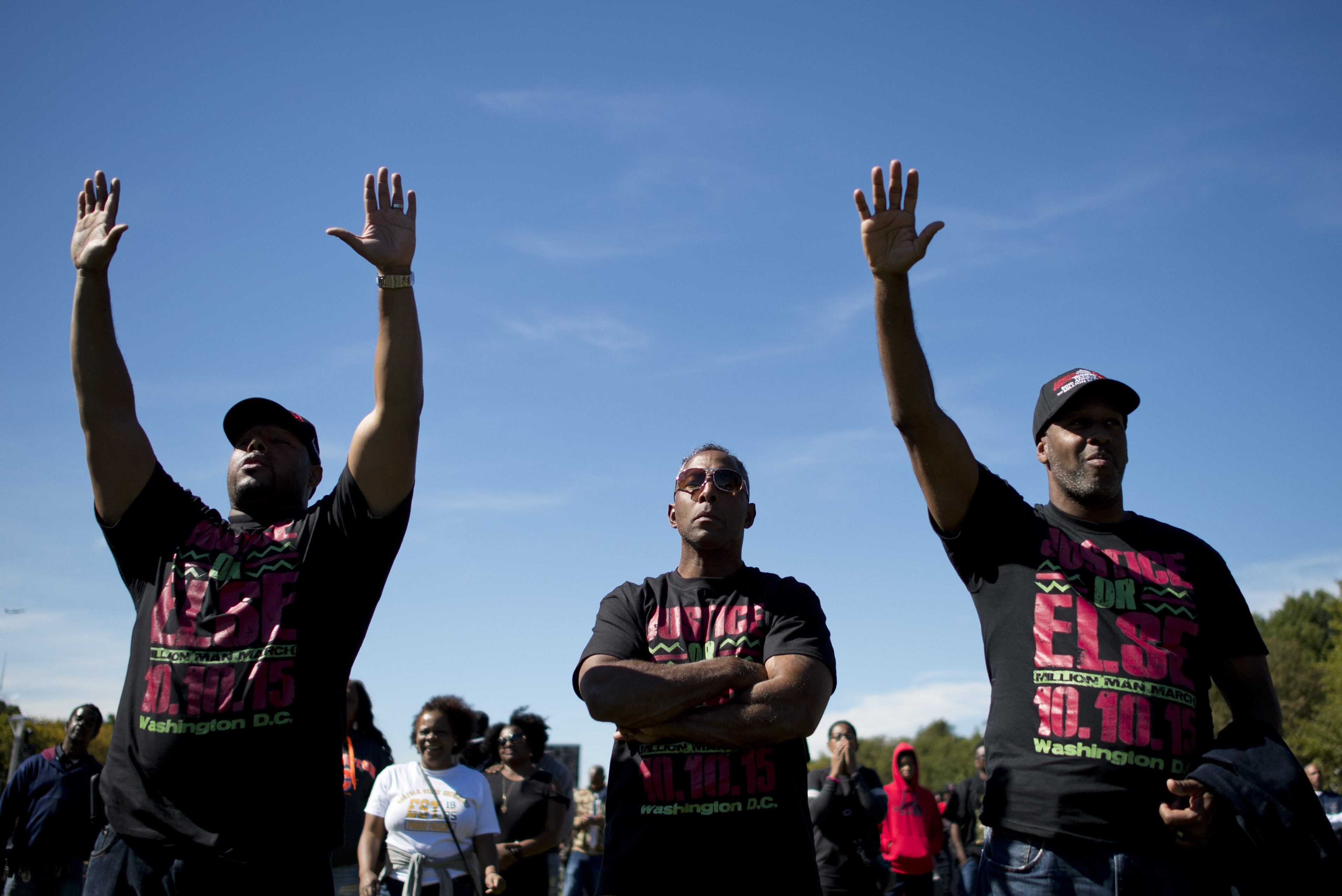 Men listen to speeches during the Justice or Else! rally on the National Mall in Washington, DC on October 10, 2015. The rally commemorates the 20th anniversary of the Million Man March which took place on October 16, 1995. AFP PHOTO/ ANDREW CABALLERO-REYNOLDS (Photo credit should read Andrew Caballero-Reynolds/AFP/Getty Images)
