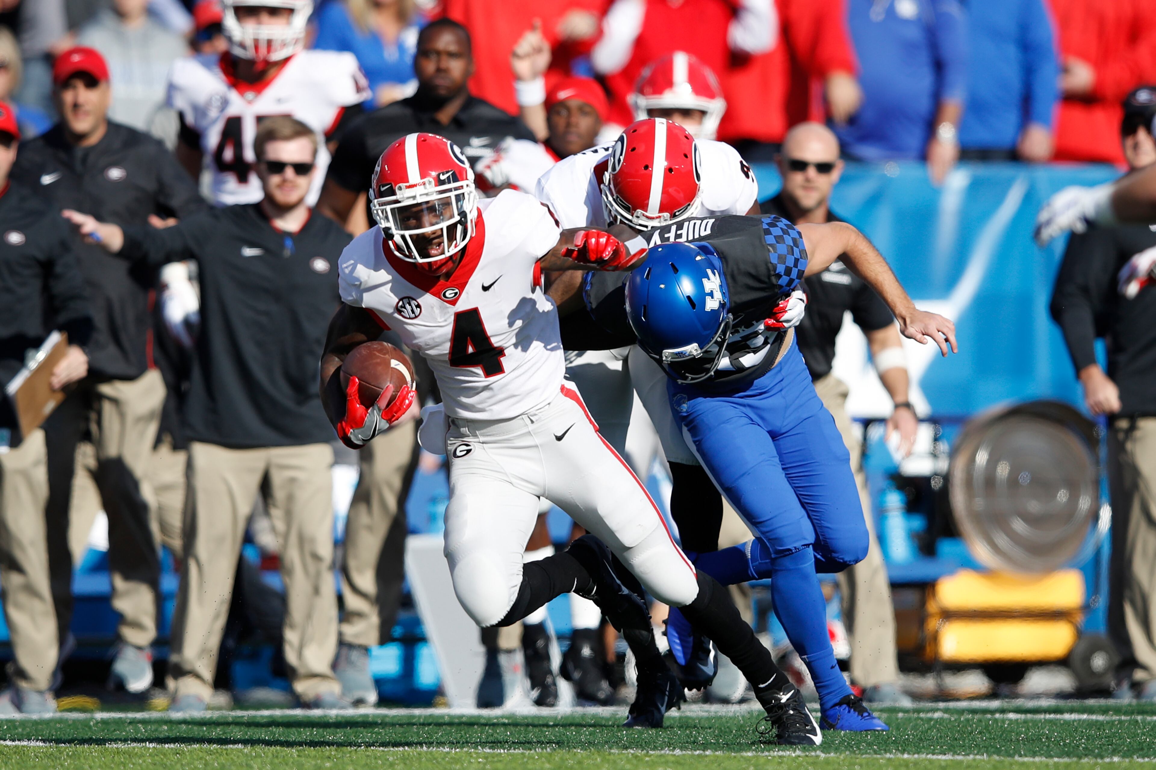 LEXINGTON, KY - NOVEMBER 03: Mecole Hardman #4 of the Georgia Bulldogs returns a punt 65 yards to set up a touchdown in the first quarter of the game against the Kentucky Wildcats at Kroger Field on November 3, 2018 in Lexington, Kentucky. (Photo by Joe Robbins/Getty Images)
