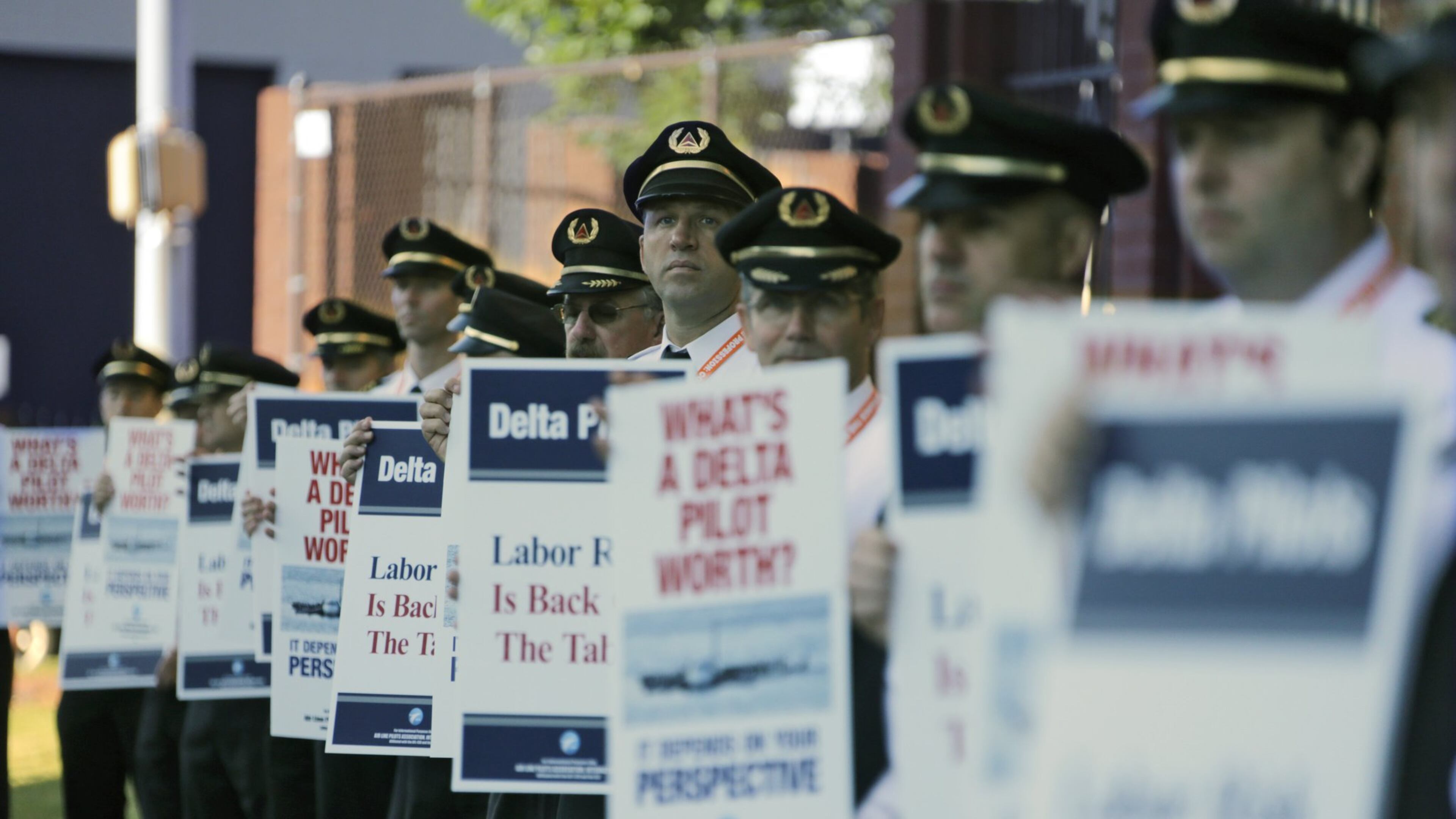 Delta Air Line pilots, represented by the Air Line Pilots Association, picketed at Delta headquarters in September. Contract negotiations took more than 19 months. BOB ANDRES /BANDRES@AJC.COM