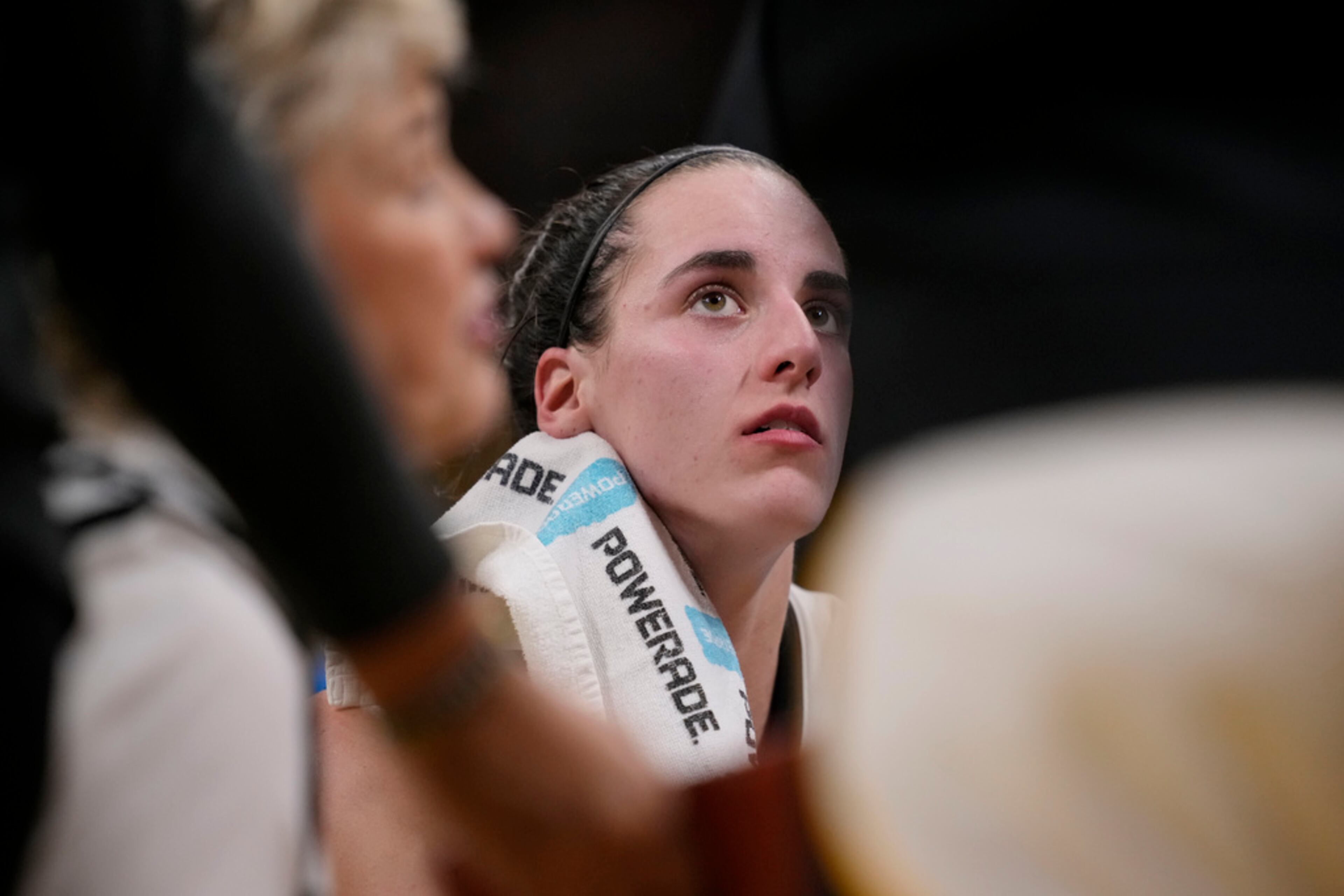 Iowa guard Caitlin Clark (22) wipes her face during a time out in the second half of an NCAA college basketball game against Michigan, Thursday, Feb. 15, 2024, in Iowa City, Iowa. Iowa won 106-89 and Clark ending the game with 49 points. (AP Photo/Matthew Putney)