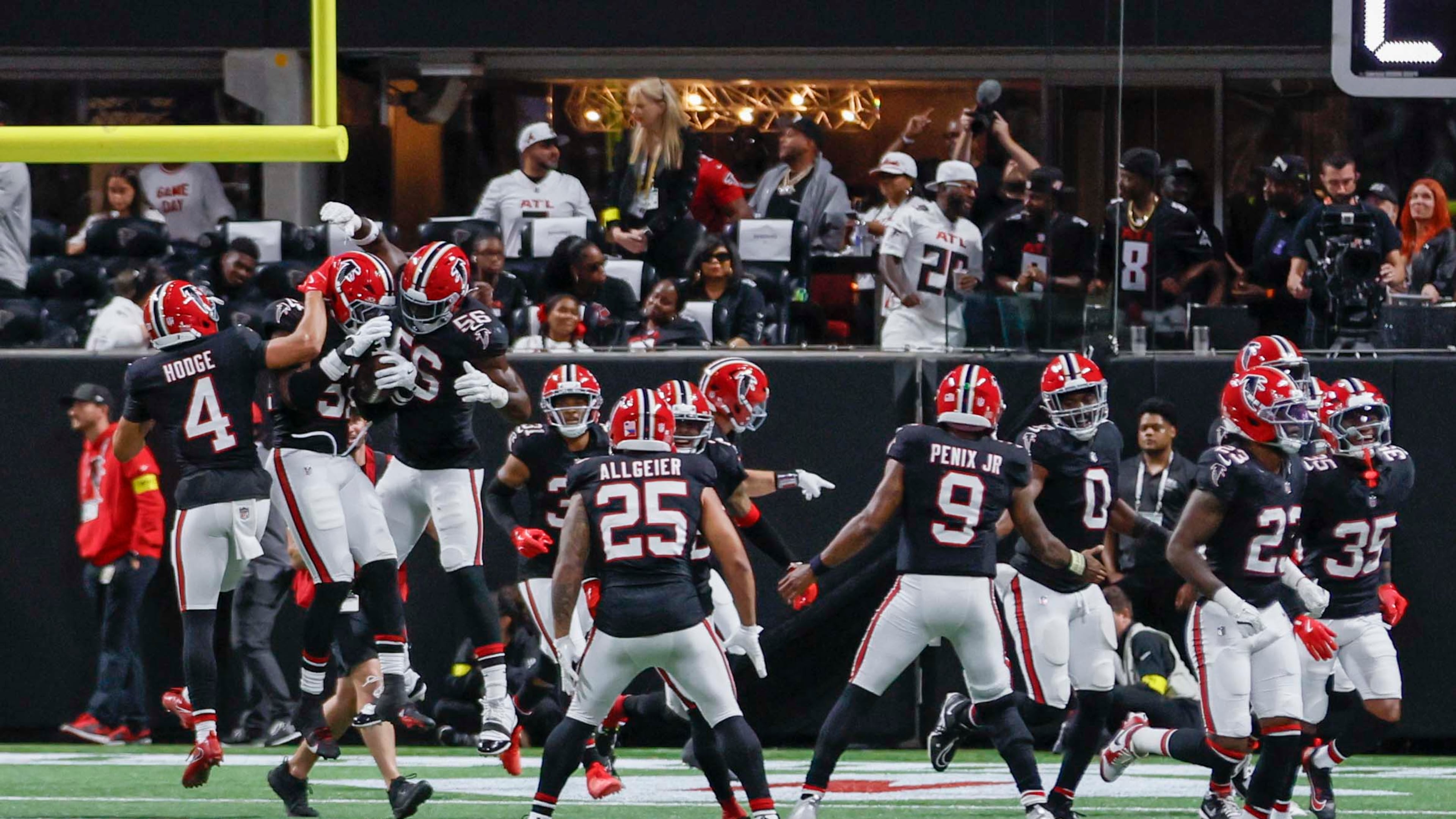 Atlanta Falcons players celebrate with linebacker DeAngelo Malone after an interception during a game against the Buffalo Bills at Mercedes-Benz Stadium on Monday, Oct. 13, 2025. (Miguel Martinez/AJC)