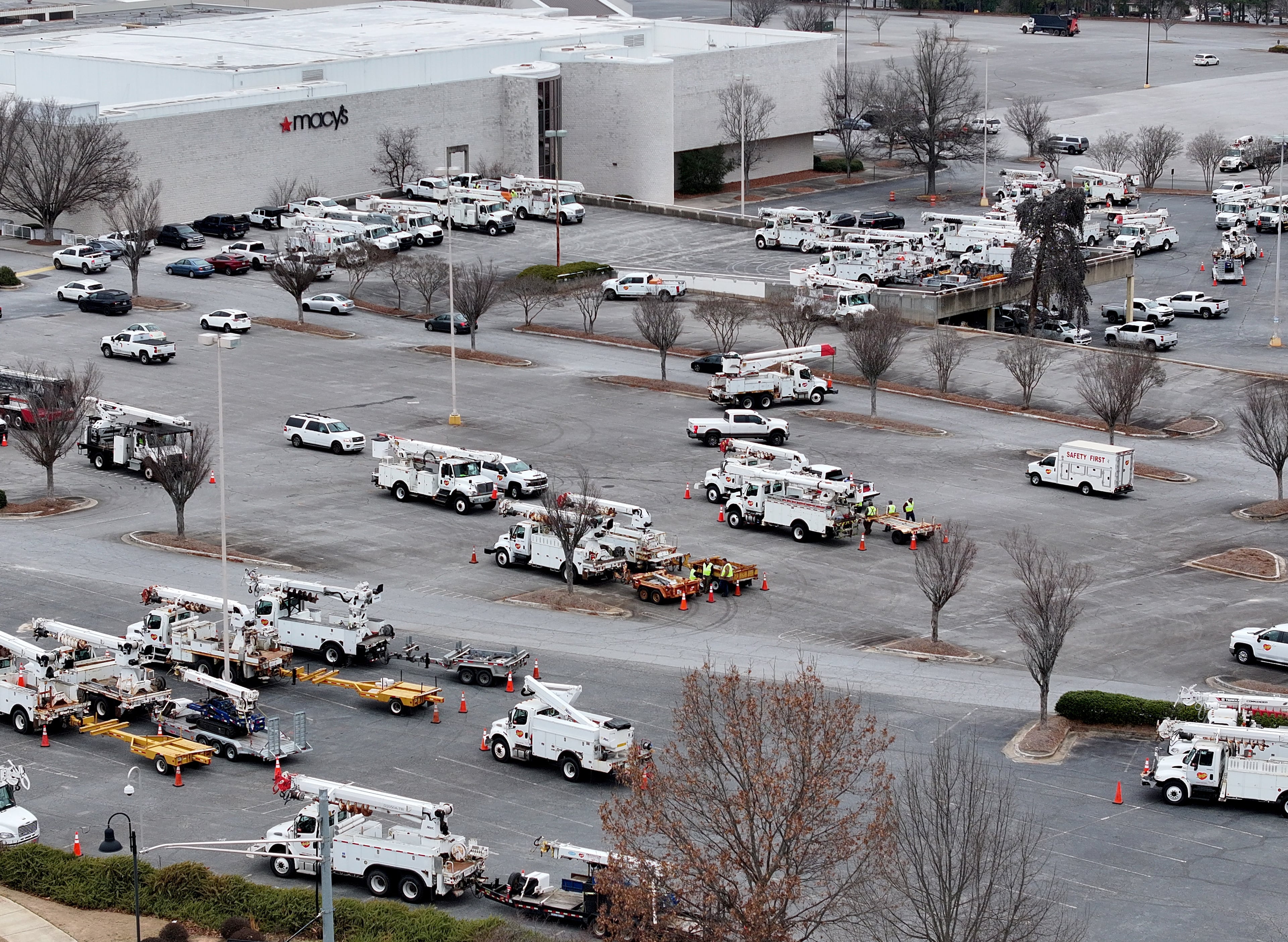 Contractor trucks for Georgia Power are staged at a parking lot at Northlake Mall, Saturday, Jan. 24, 2026, in Atlanta. (Hyosub Shin/AJC)