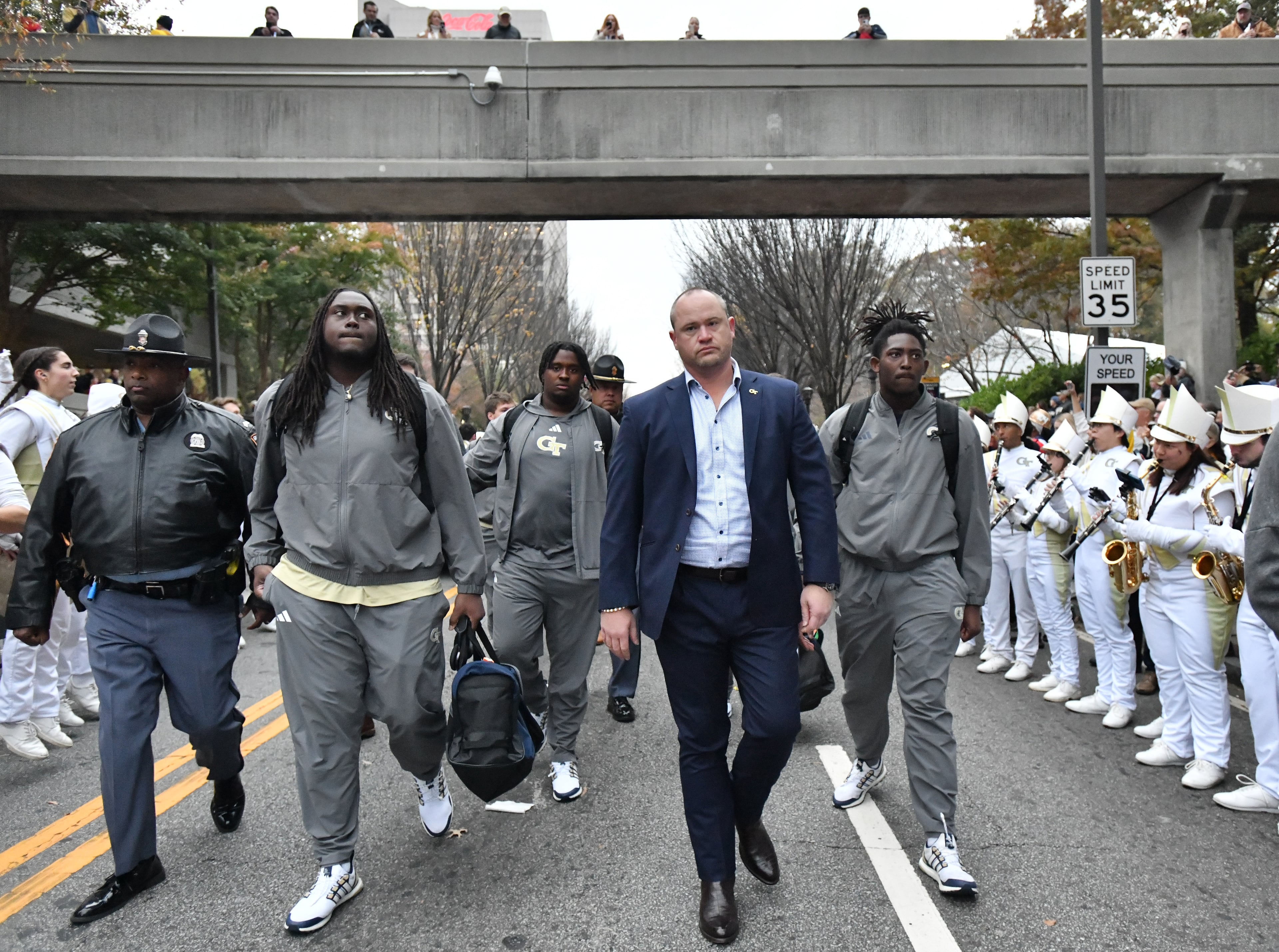 Georgia Tech head coach Brent Key (center), players and coaching staff participate in Yellow Jacket Alley prior to an NCAA college football game against Georgia at Georgia Tech's Bobby Dodd Stadium, Saturday, November 25, 2023, in Atlanta. (Hyosub Shin / Hyosub.Shin@ajc.com)
