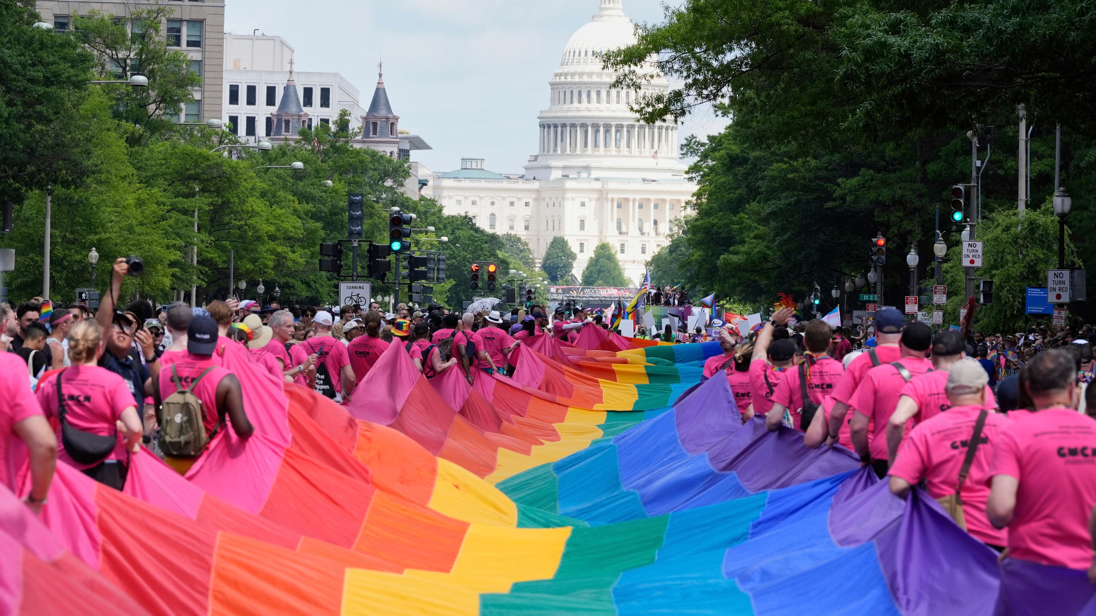 FILE - Participants carry a large pride flag during the World Pride parade with the U.S. Capitol in the background, June 7, 2025, in Washington. (AP Photo/Mark Schiefelbein, file)