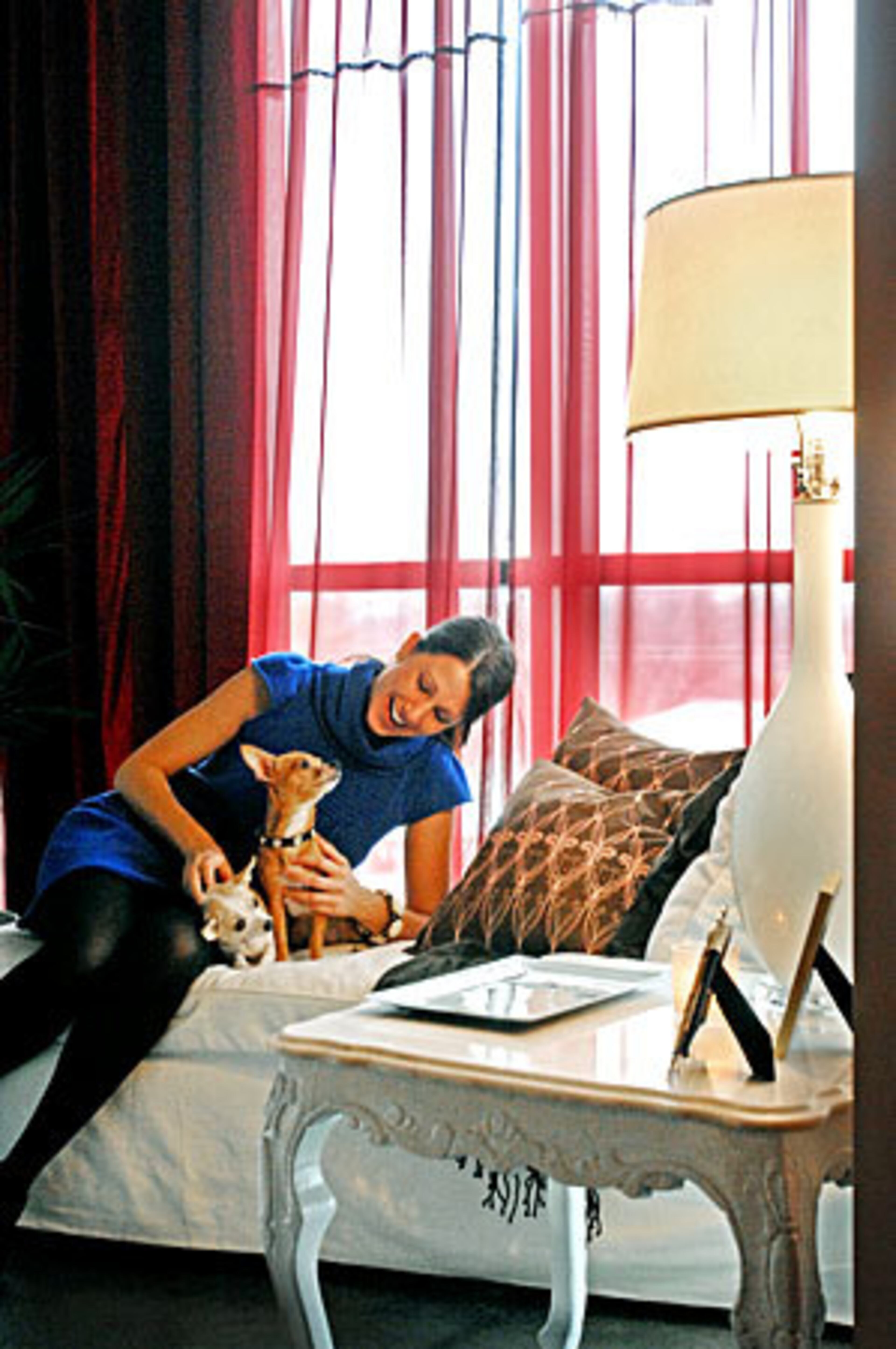 West with dogs Morgan (left), and Charlie in her Tribute Lofts unit.