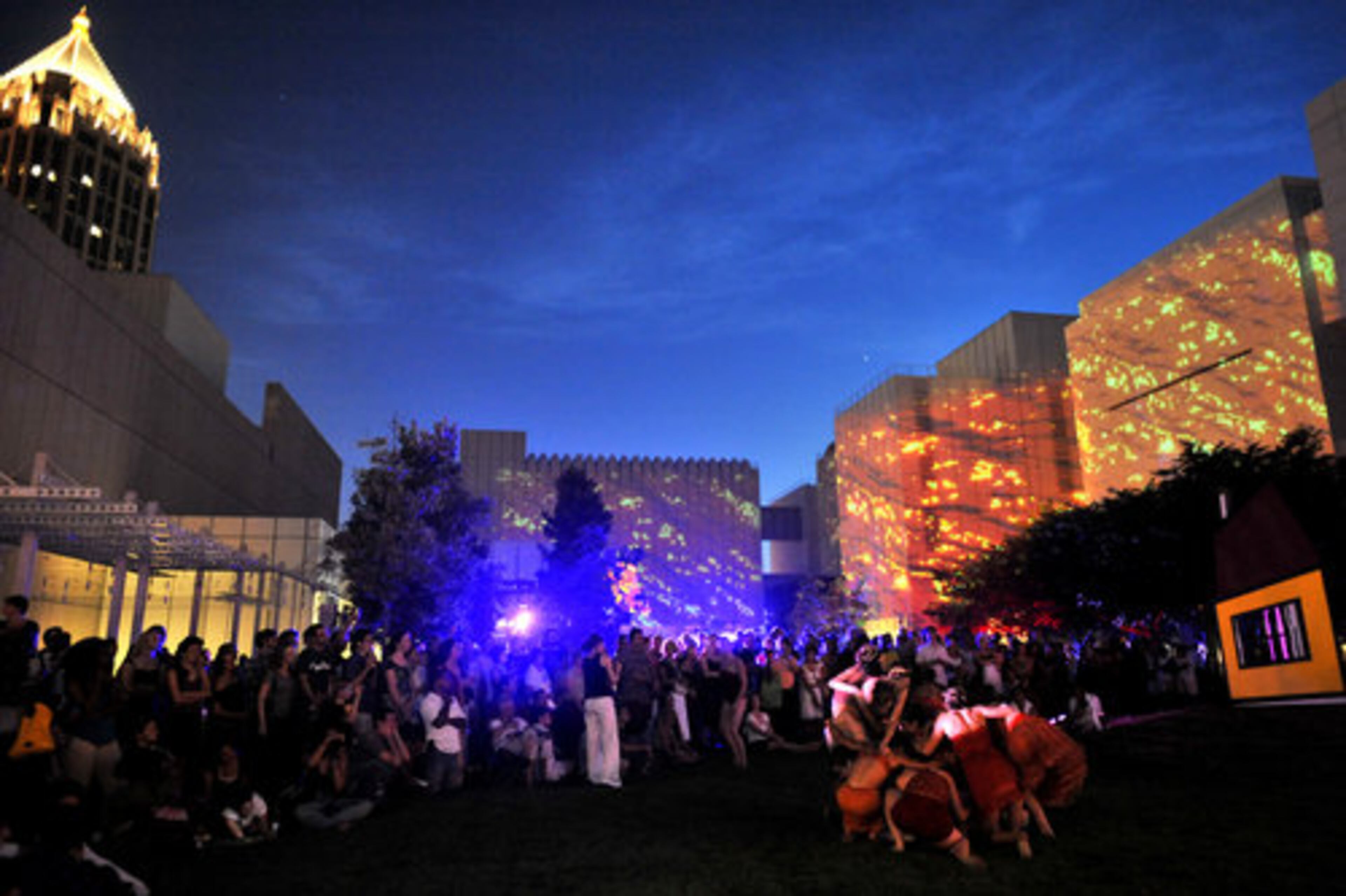 People watch gloATL artists performing "Big Science" during Roem.