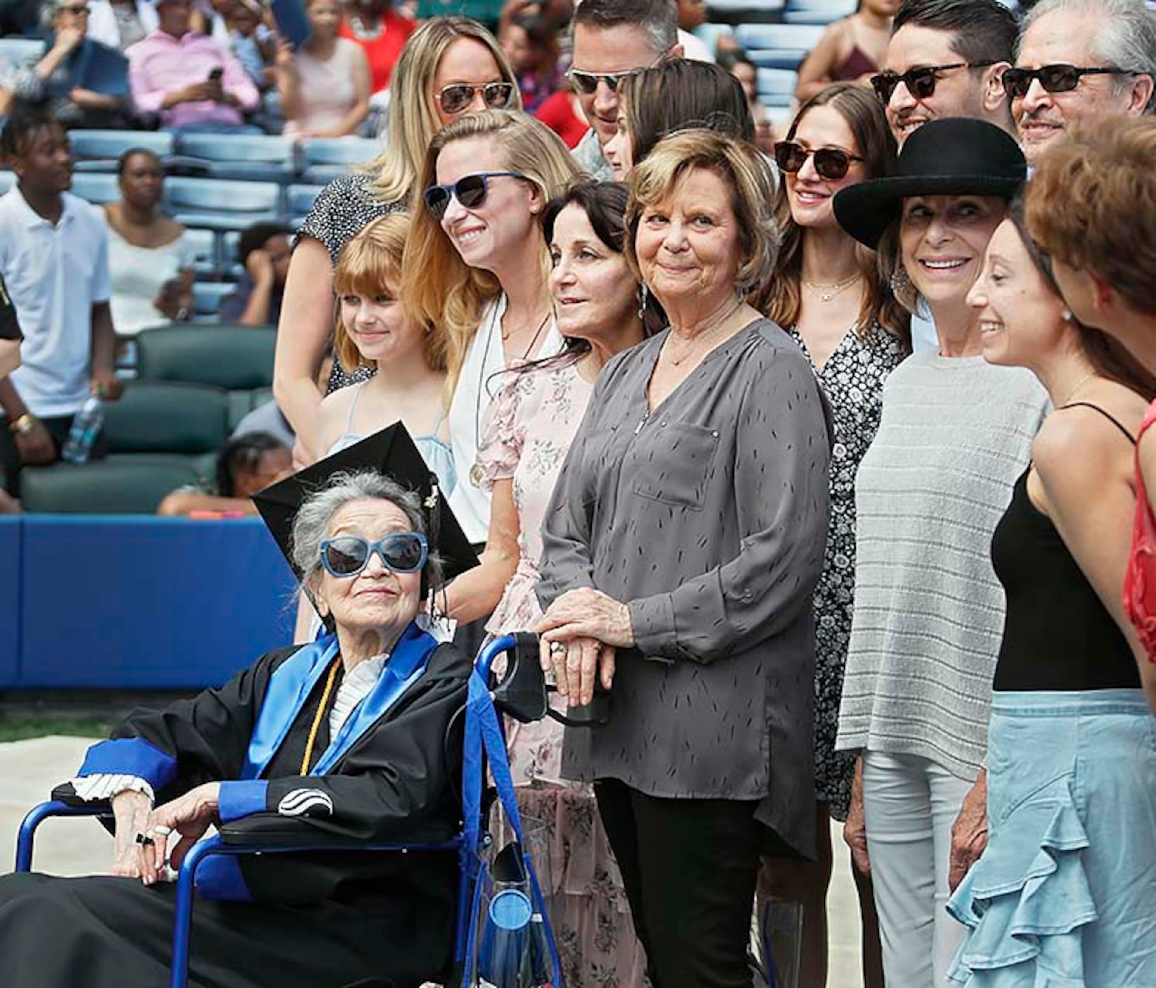 Joyce Lowenstein, 93, gathers with family members for a group photo after she received her bachelor's degree Thursday from Georgia State University. She started taking classes there in 2012, Her degree is in art history.
