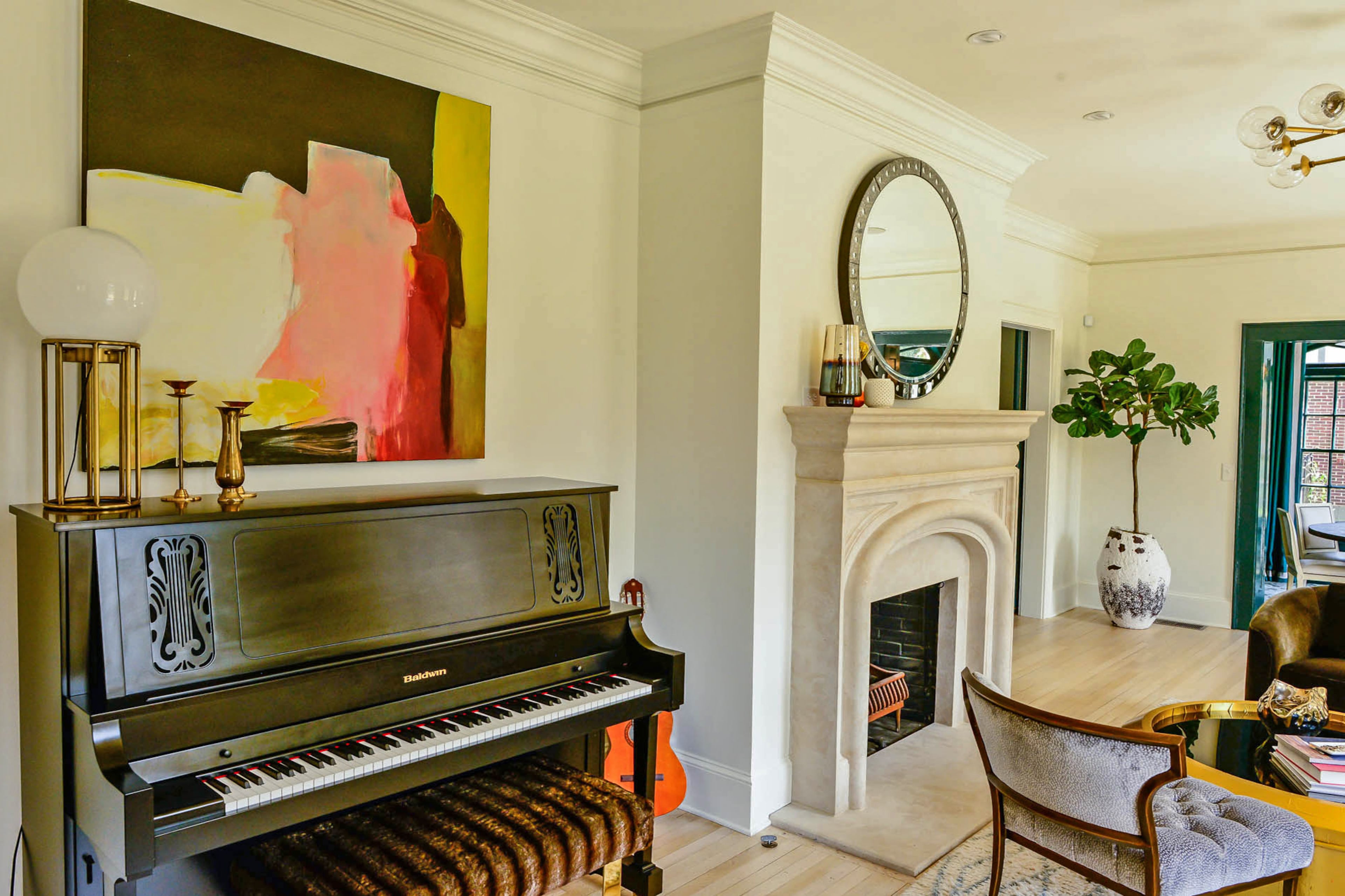 The stone fireplace by Francois & Co. was inspired by the style of the limestone header of the front door in the 1926 home in the Atlanta neighborhood.