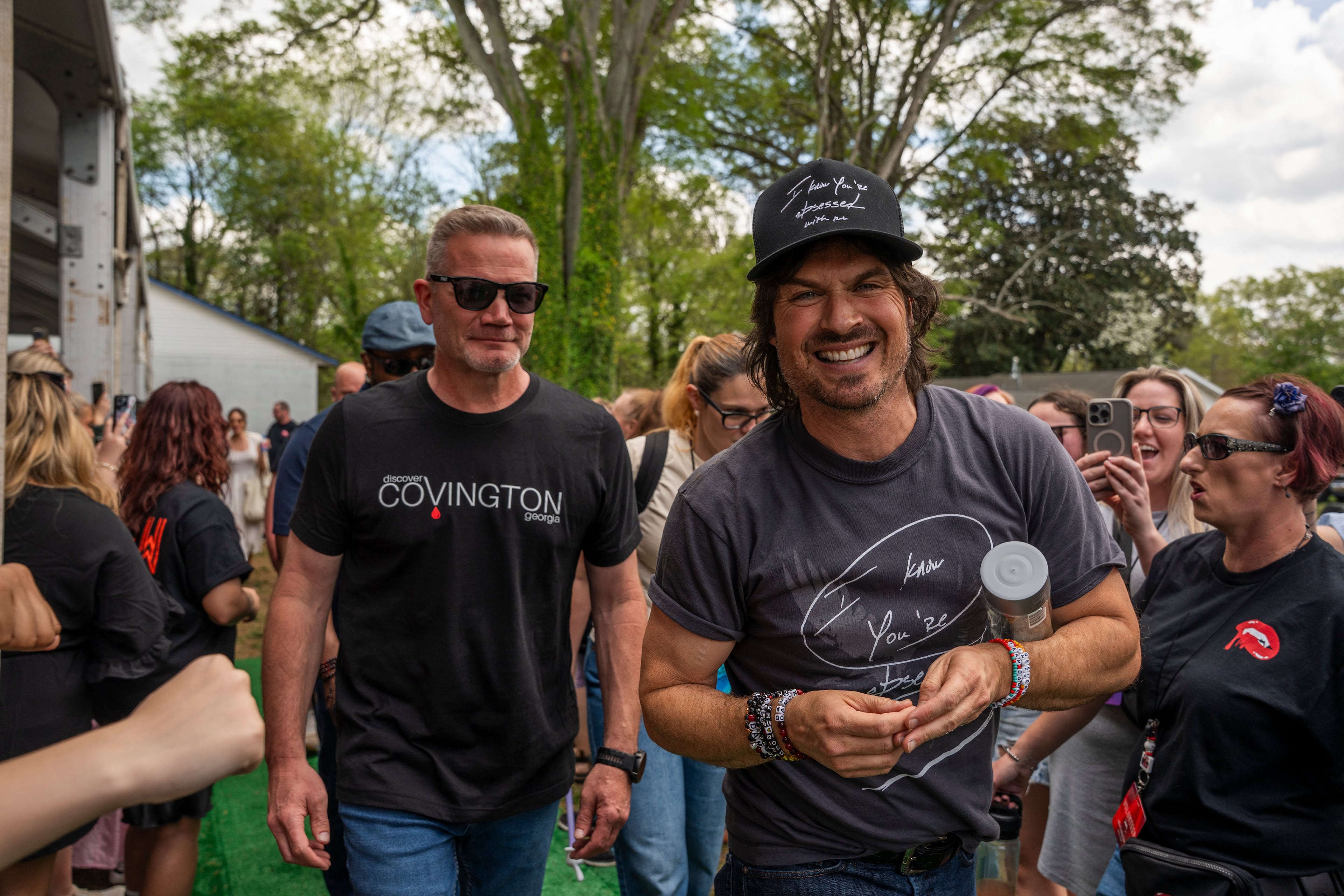 Ian Somerhalder, who played Damon Salvatore on “The Vampire Diaries,” fist-pumps fans as he exits the stage at the Epic conference in Covington, Ga., on Friday, April 5, 2025. (Olivia Bowdoin for the AJC)