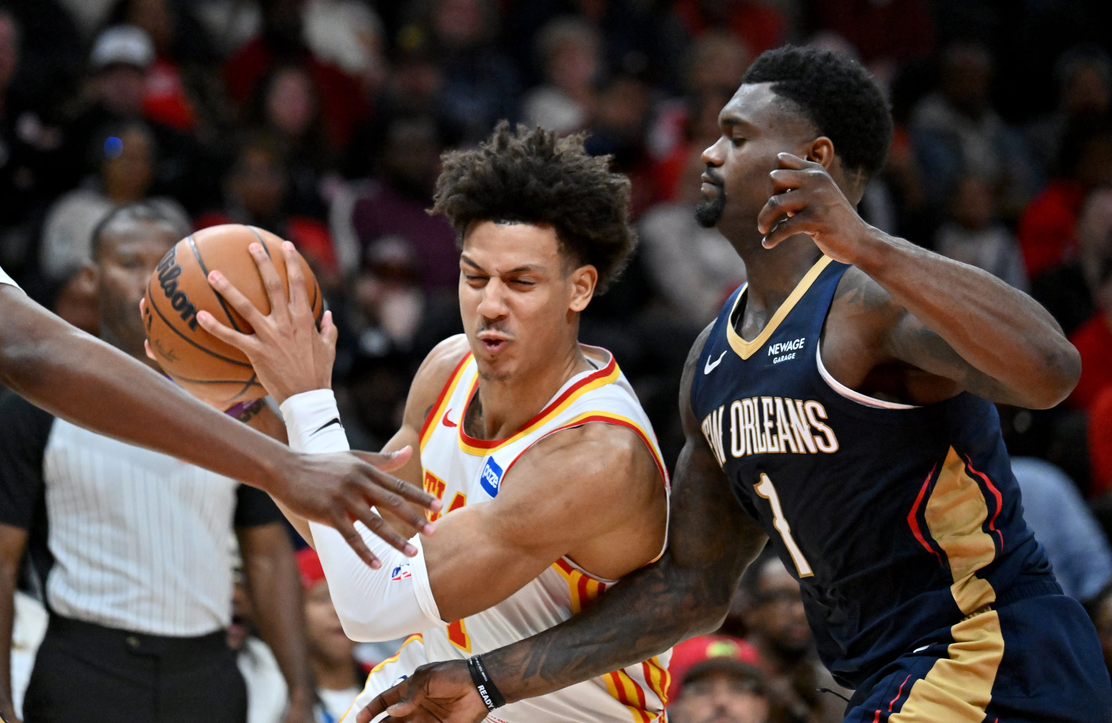 Atlanta Hawks forward Jalen Johnson (1) drives against New Orleans Pelicans forward Zion Williamson (1) during the first half in an NBA basketball game at State Farm Arena, Wednesday, Jan. 7, 2026, in Atlanta. (Hyosub Shin/AJC)