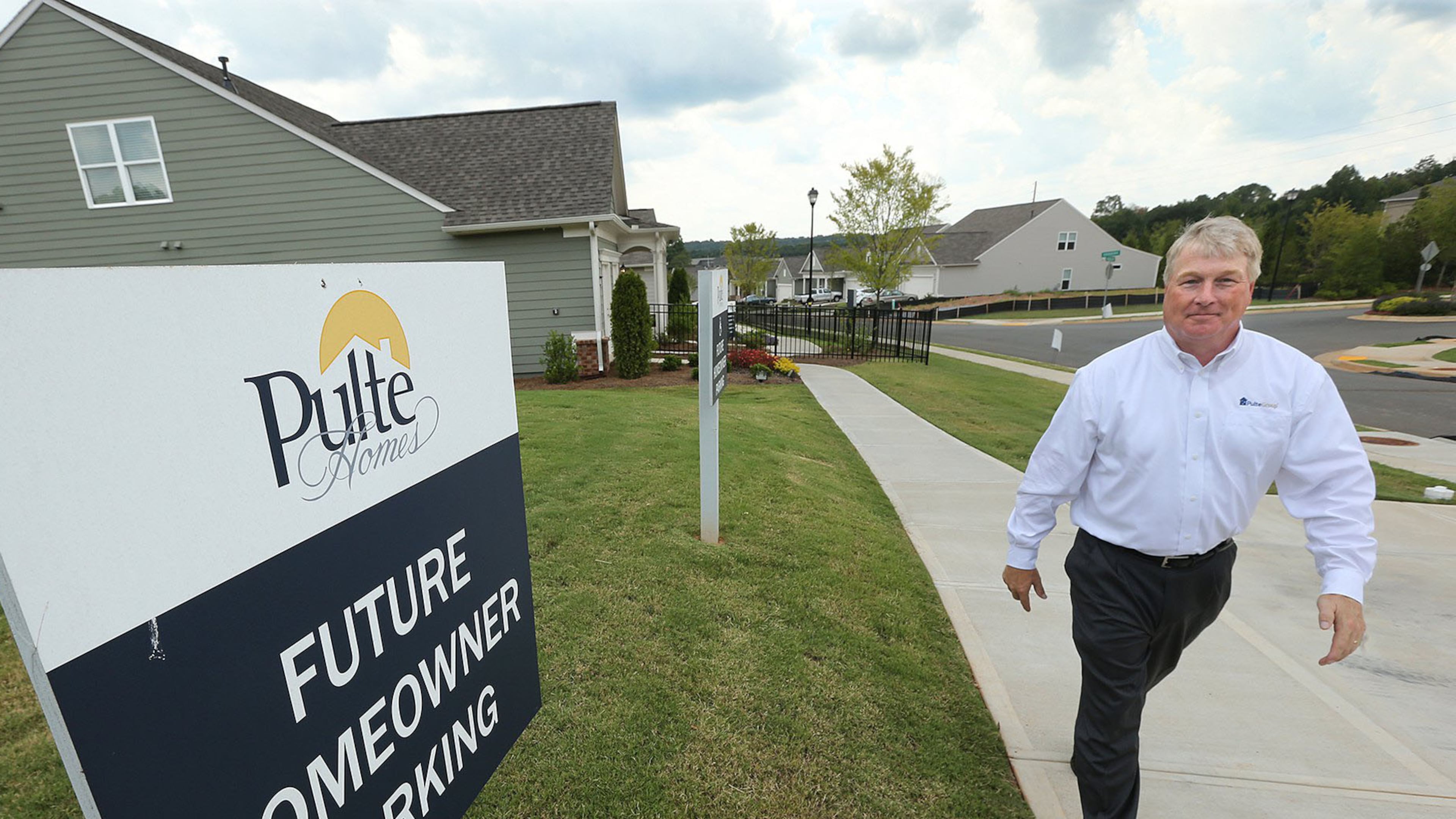 Casey Hill, president of the Georgia division of Pulte Homes, leaves a model home at Woodview Court in Woodstock. Pulte has sold 80 homes in the development since it opened last fall.