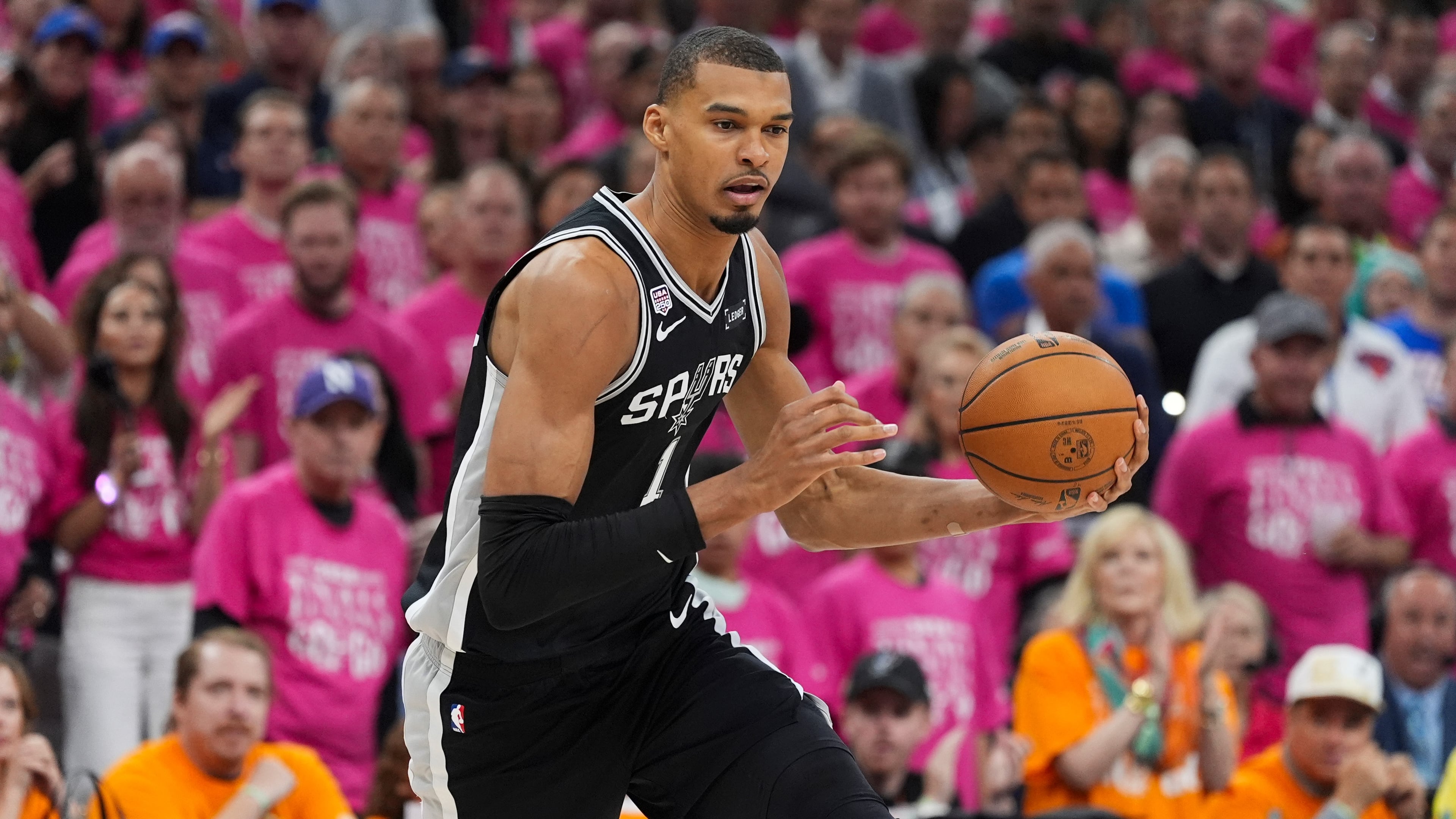 San Antonio Spurs forward Victor Wembanyama (1) drives against the New York Knicks during the first half of Game 1 of the NBA Finals basketball series, Wednesday, June 3, 2026, in San Antonio. (AP Photo/Eric Gay)