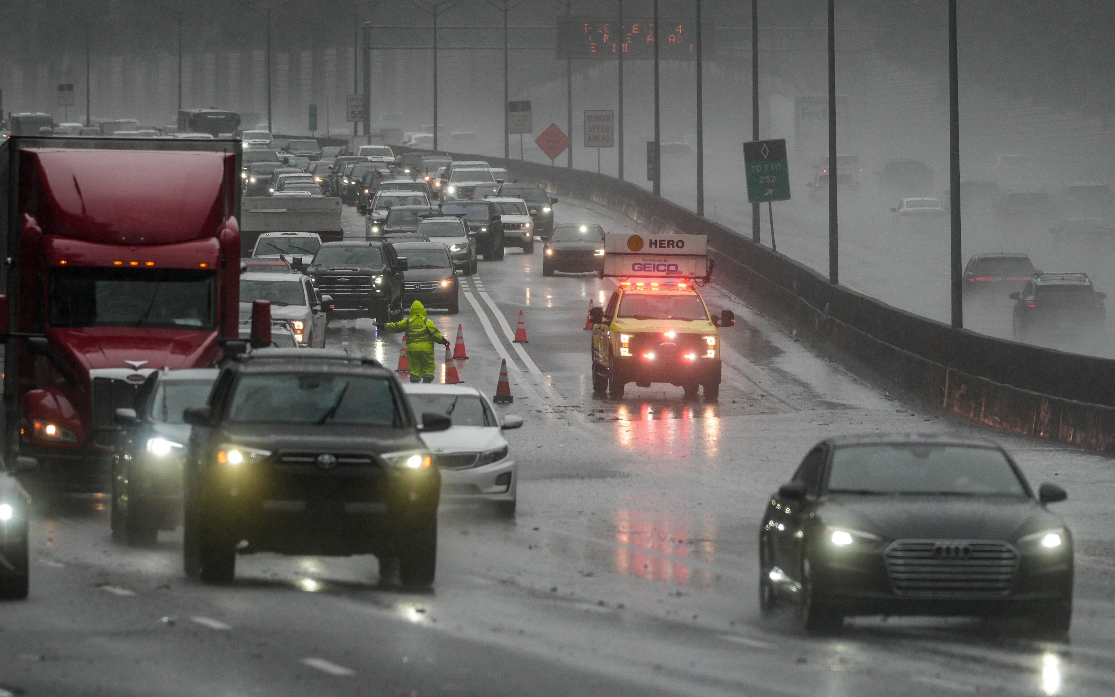 Two left lanes are blocked on I-75 North at Moores Mill Road due to flooding on Saturday, Sept. 12, 2026. (Ben Hendren for The Atlanta Journal-Constitution)