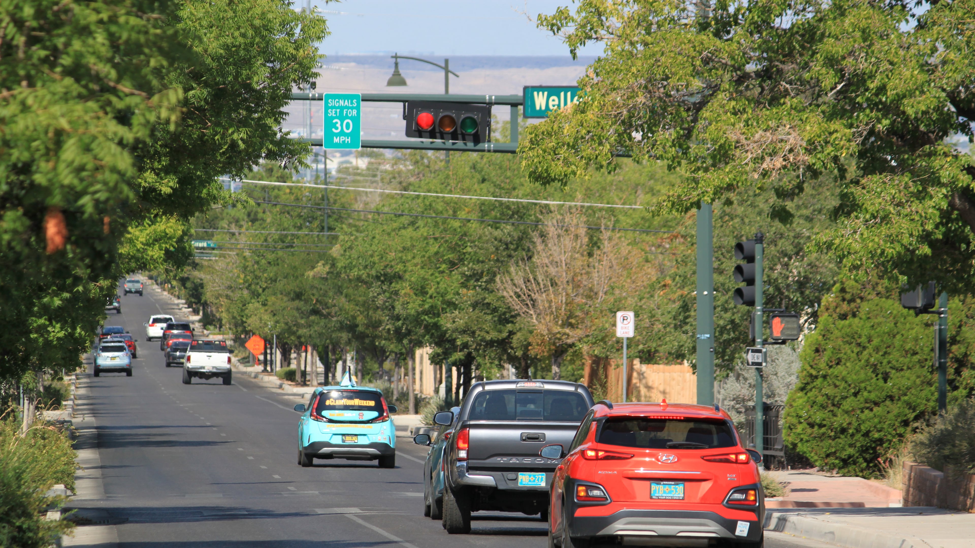 Vehicles stop along Lead Avenue where stoplights are set for a specific speed limit as part of the "rest on red" signal program in Albuquerque, N.M., Wednesday, Aug. 12, 2026. (AP Photo/Susan Montoya Bryan)