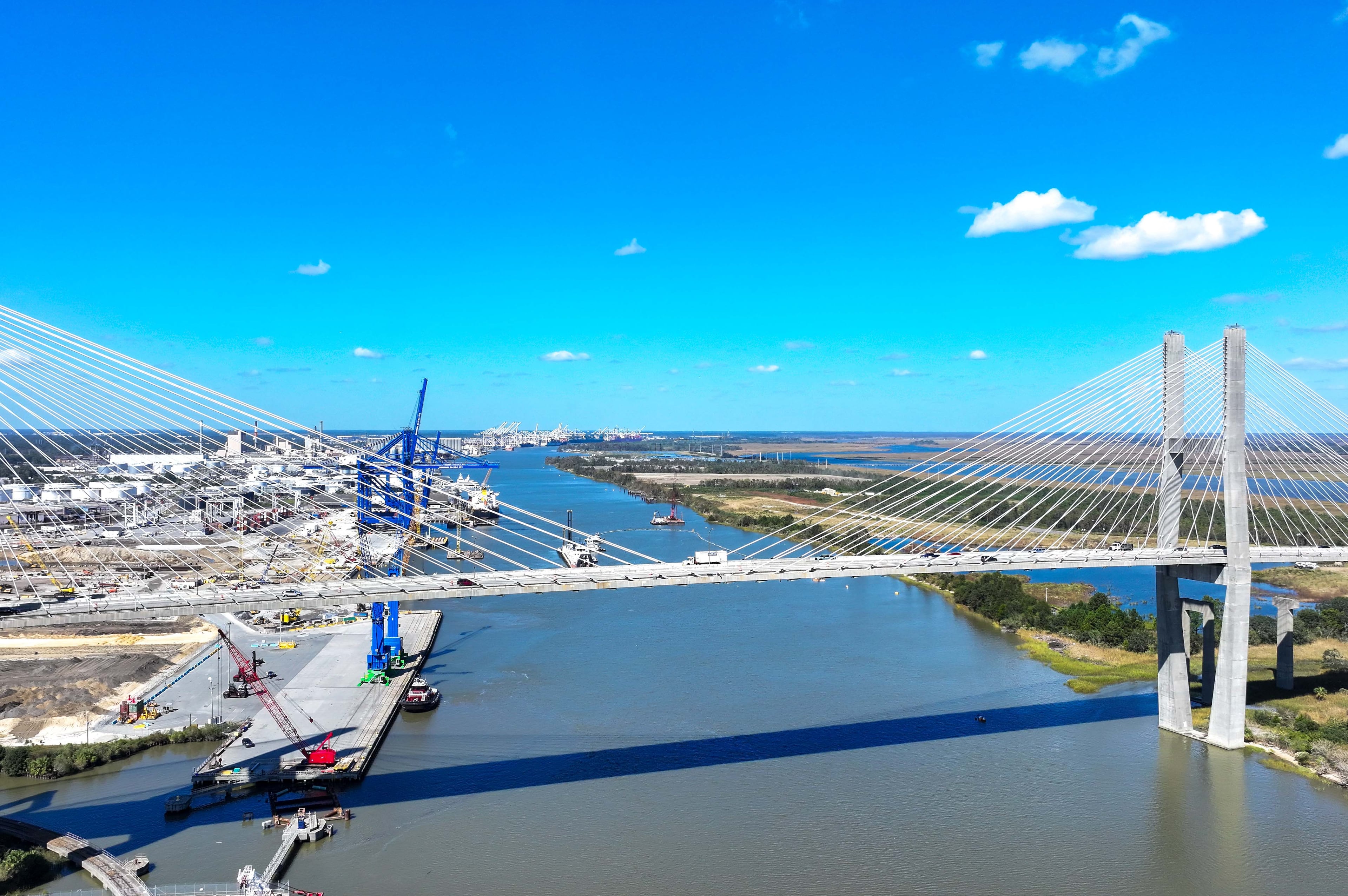 An aerial image of the Talmadge Bridge above the Savannah River with the Georgia Ports Authority Ocean Terminal in the background is seen on Wednesday, Oct. 23, 2024. (Miguel Martinez/AJC)