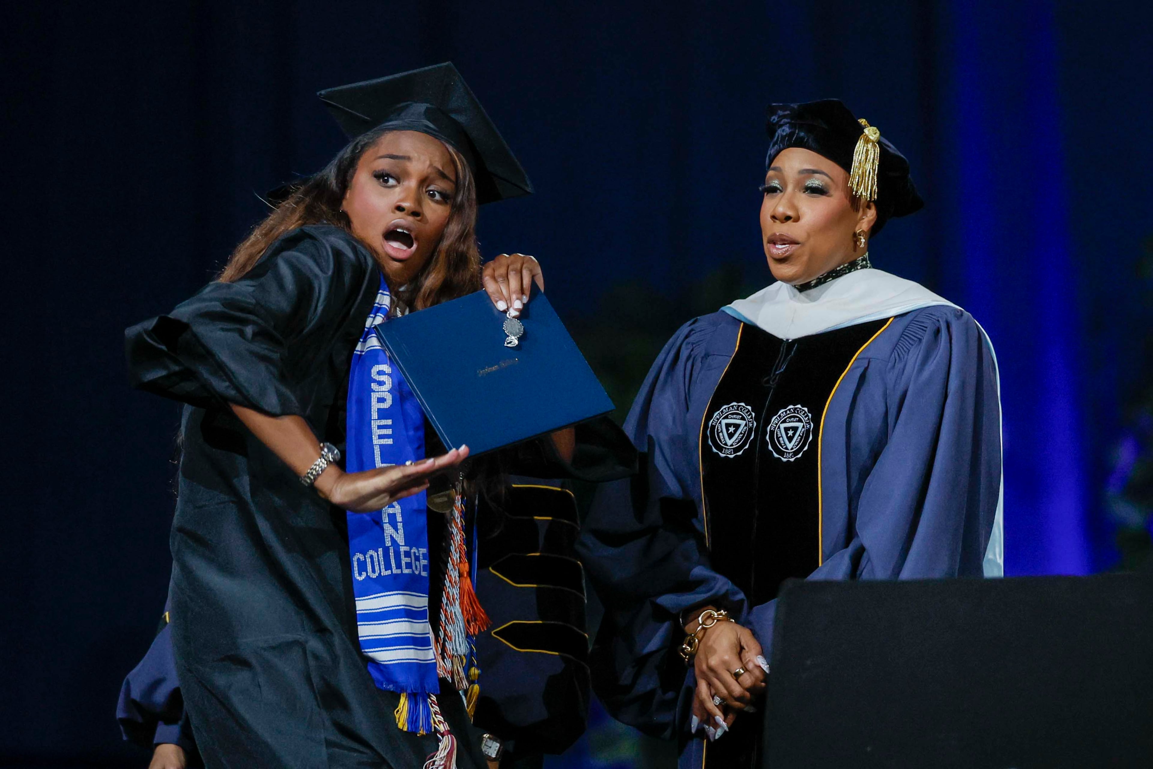 A graduate reacts after receiving her diploma during the Spelman College Commencement at the Georgia International Convention Center in College Park on Sunday, May 17, 2026. (Miguel Martinez/AJC)