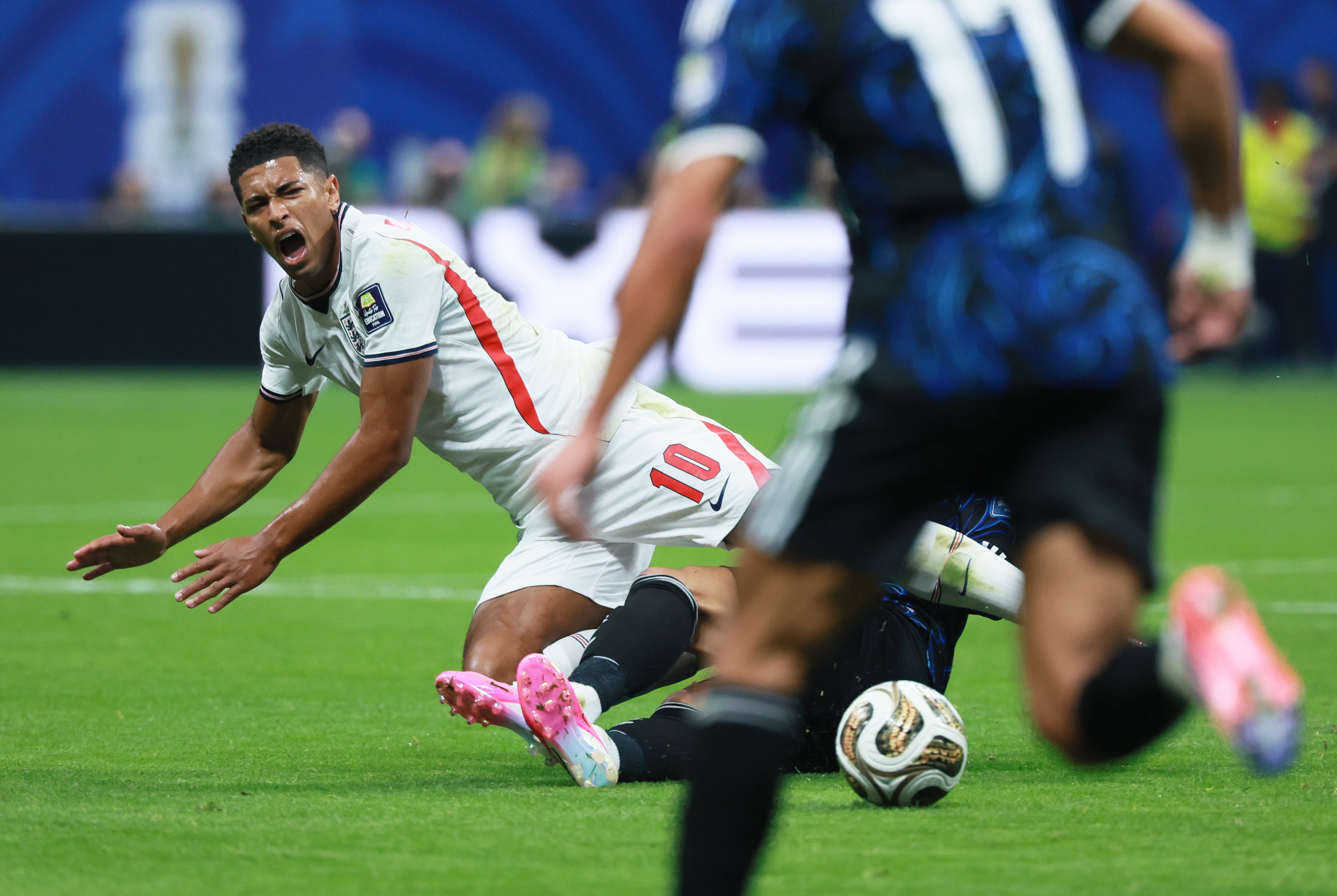 England's Jude Bellingham is upended going for ball during first half of Argentina vs. England FIFA World Cup Semifinal match at Atlanta Stadium (Mercedes-Benz Stadium) on Wednesday, July 15, 2026. (Jason Getz/AJC)