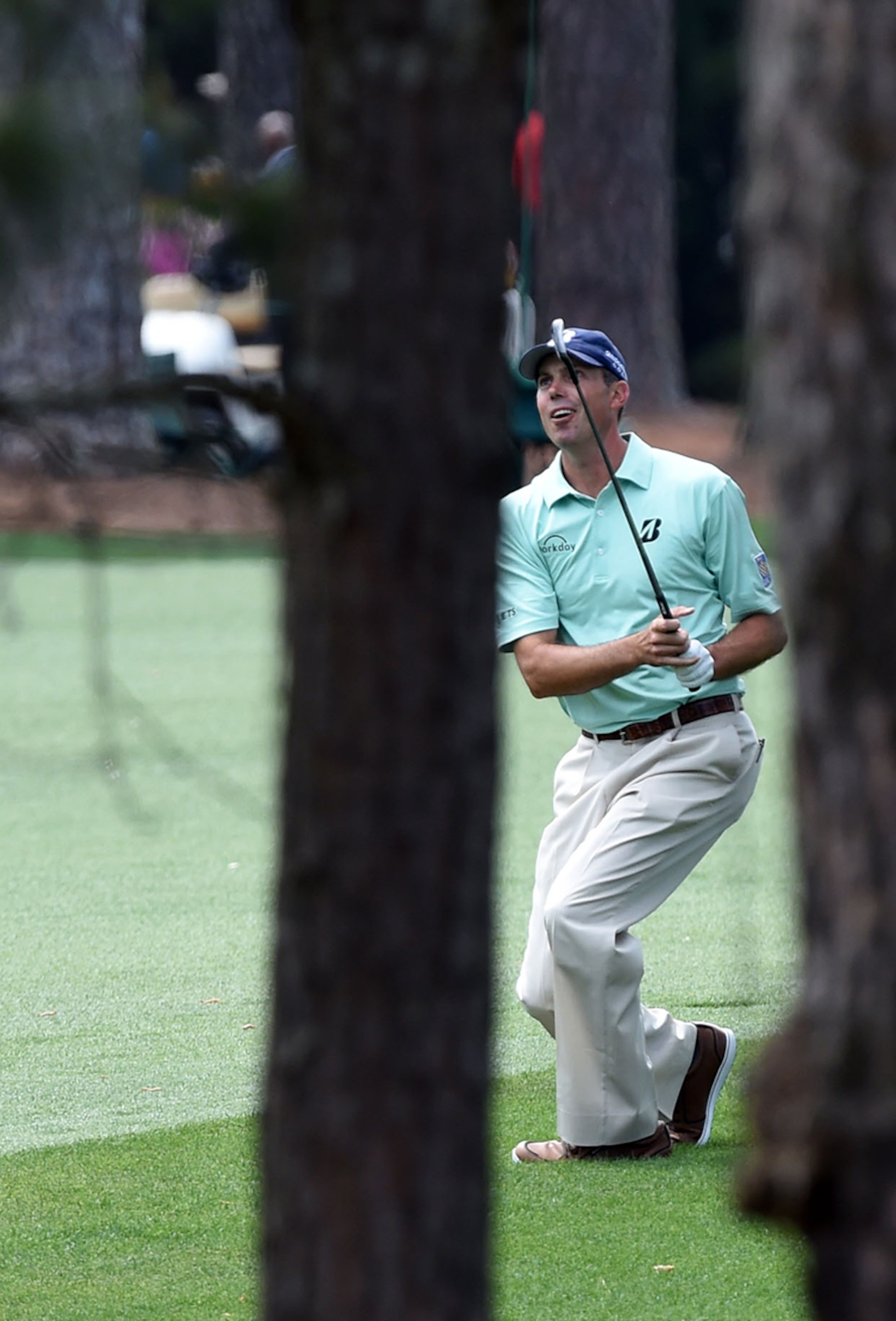 Matt Kuchar follows his approach shot on No. 7 during the final round of the Masters Tournament Sunday, April 13, 2014, at Augusta National Golf Club.