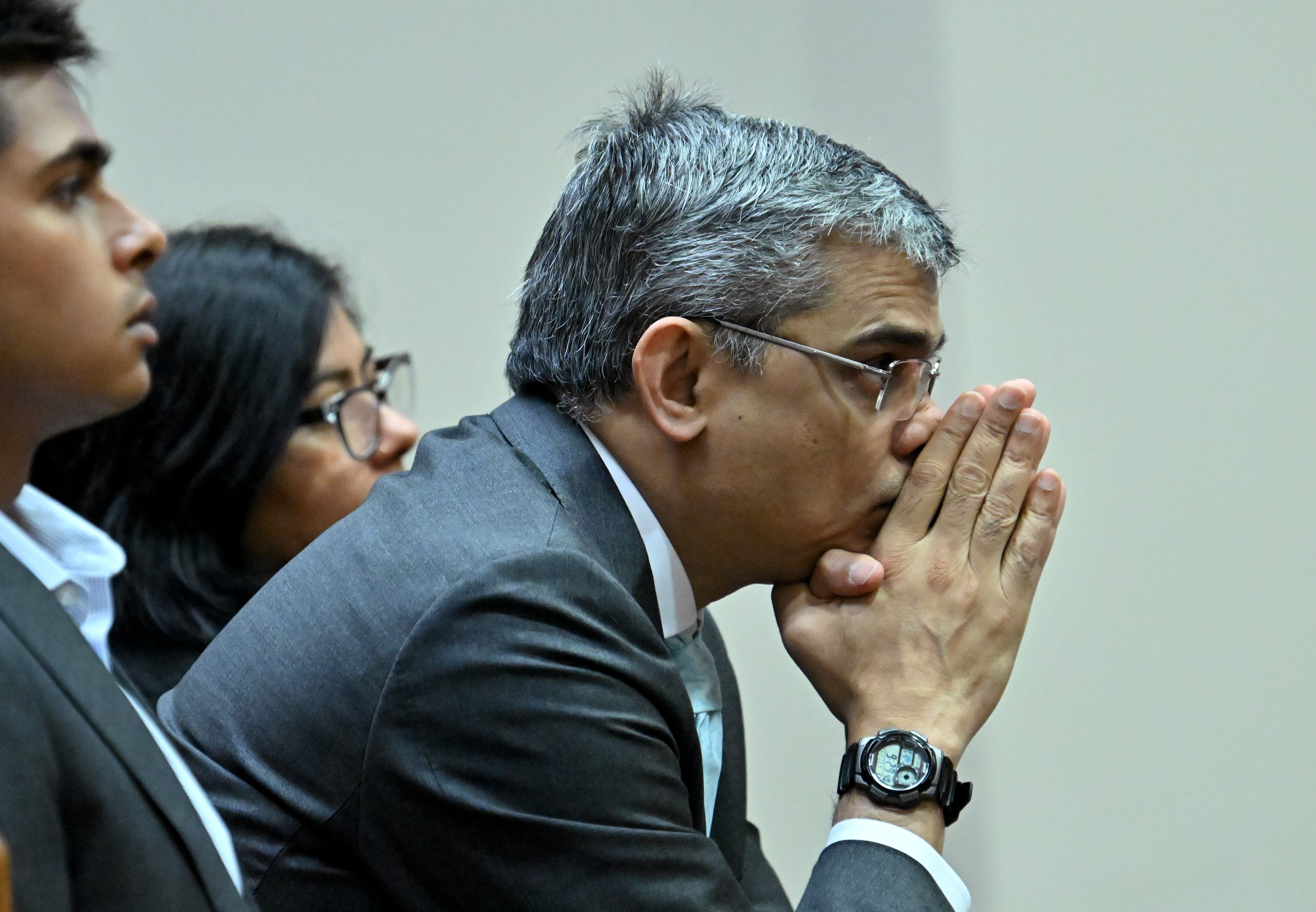 Sumanth (center) and Anindita Rao, Ananya's parents, sit with their son Nitin (left) during a hearing before Superior Court Judge Tangela Barrie at DeKalb County Courthouse in April 2026. (Hyosub Shin/AJC)