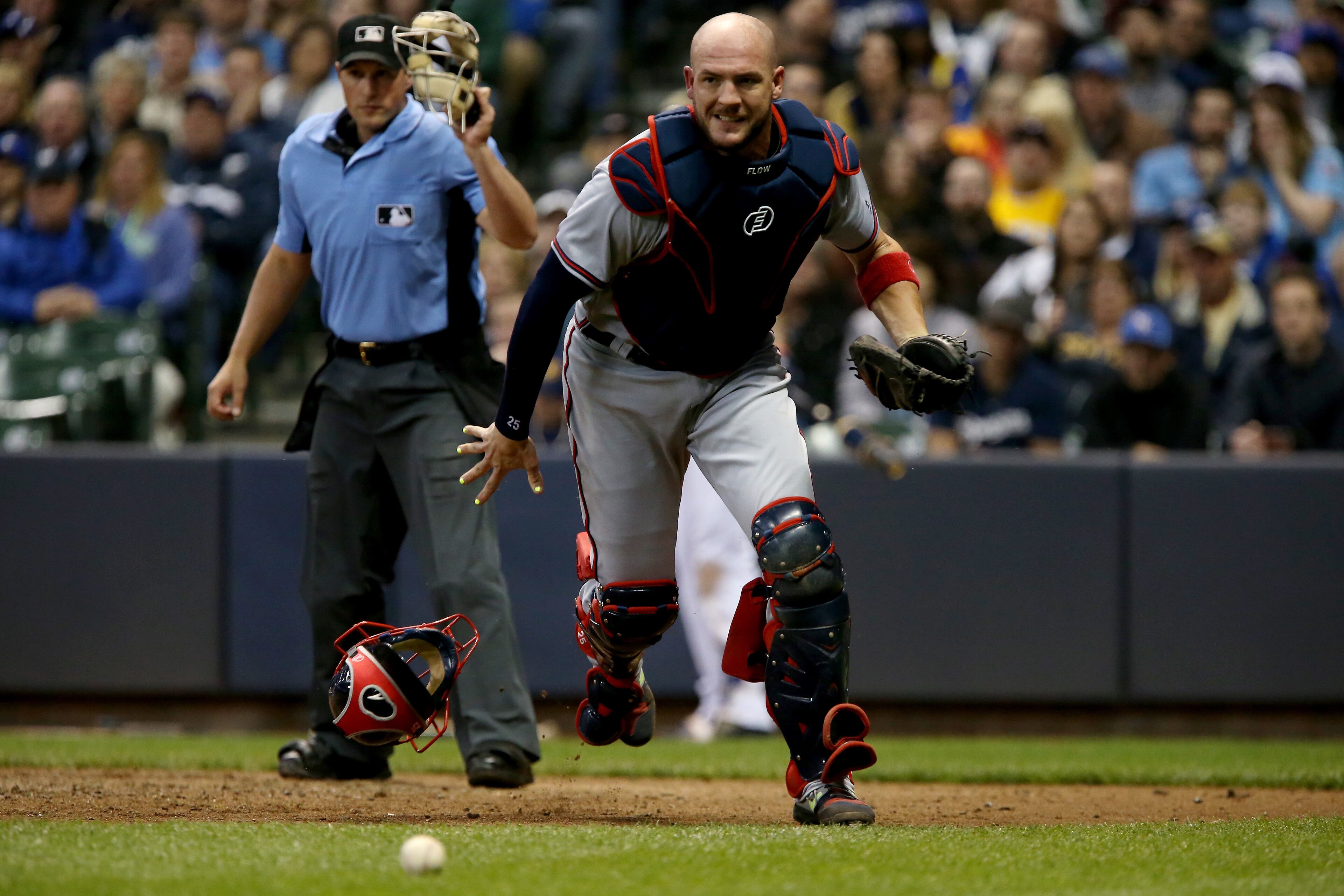 MILWAUKEE, WI - APRIL 29: Tyler Flowers #25 of the Atlanta Braves chases after a wild pitch in the fifth inning against the Milwaukee Brewers at Miller Park on April 29, 2017 in Milwaukee, Wisconsin. (Photo by Dylan Buell/Getty Images)