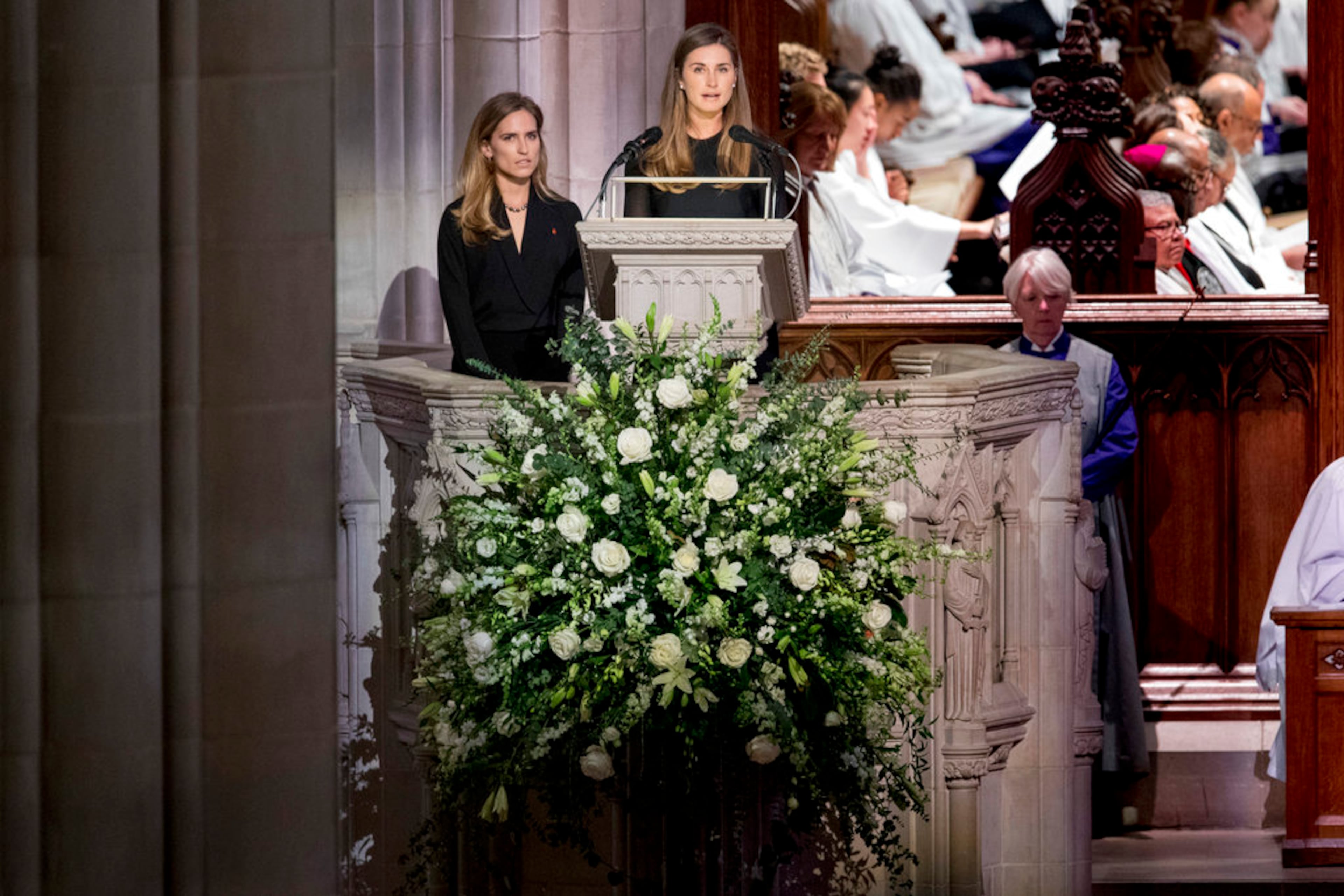 Lauren Bush, and Ashley Walker Bush, let, grandchildren of former President George H.W. Bush, speak during his State Funeral at the National Cathedral, Wednesday, Dec. 5, 2018, in Washington. (AP Photo/Andrew Harnik, Pool)