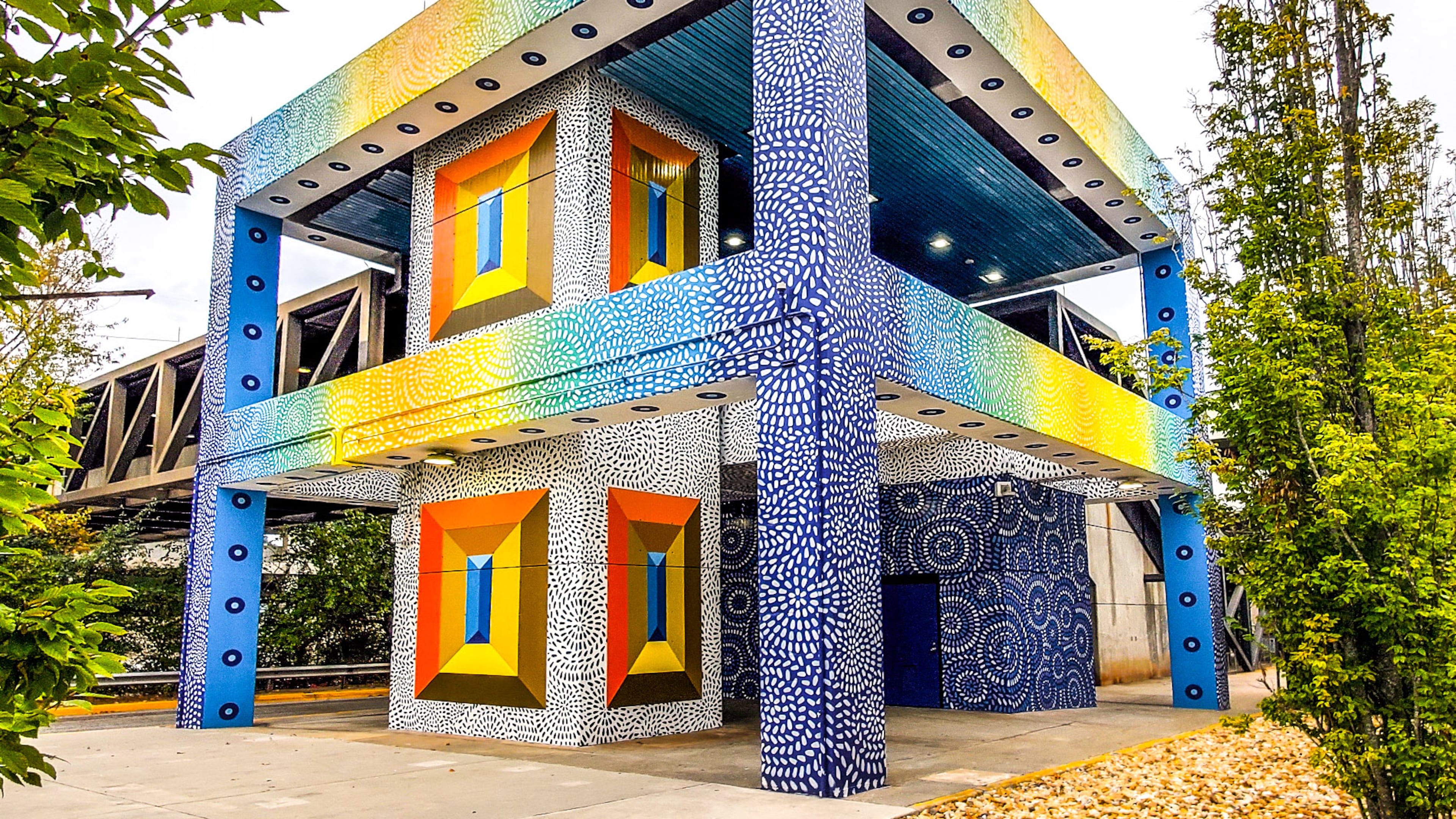 The colorful mural on the Edgewood-Candler Park MARTA station by Milagros Collective has recast a cold concrete entryway into one that packs visual pizzazz. (Arthur Rudick/Courtesy of ArtsATL)