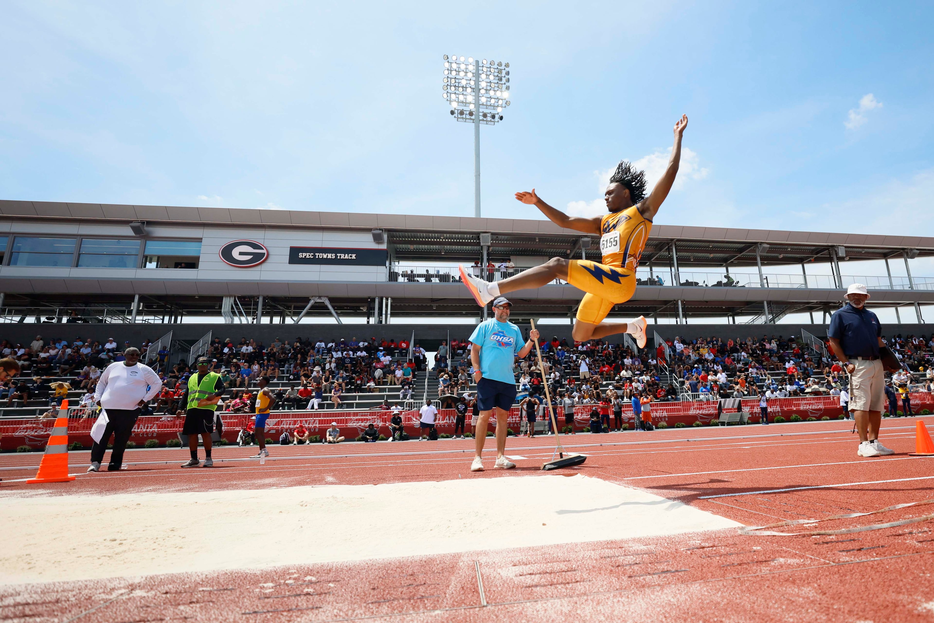 An athlete attempts a long jump at the GHSA track and field state championships held at UGA's Spec Towns Track on Monday, May 11, 2026, in Athens. (Miguel Martinez/AJC)