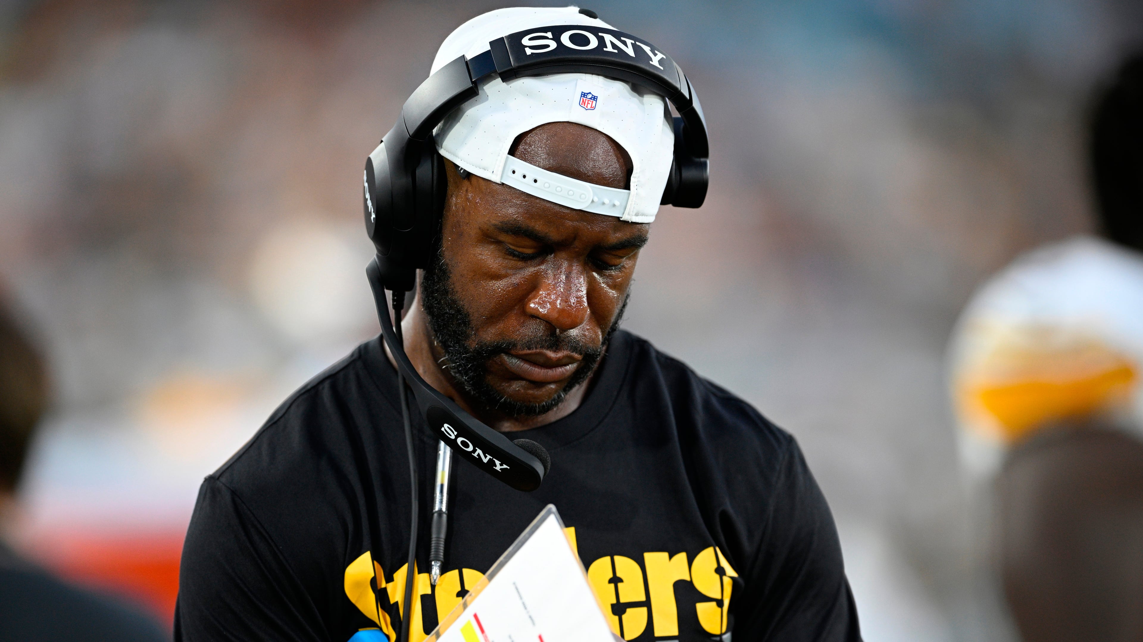 FILE - Then-Pittsburgh Steelers defensive backs coach Gerald Alexander writes down notes on the sideline during the first half of an NFL preseason football game against the Jacksonville Jaguars, Aug. 9, 2025, in Jacksonville, Fla. (AP Photo/Phelan M. Ebenhack, File)