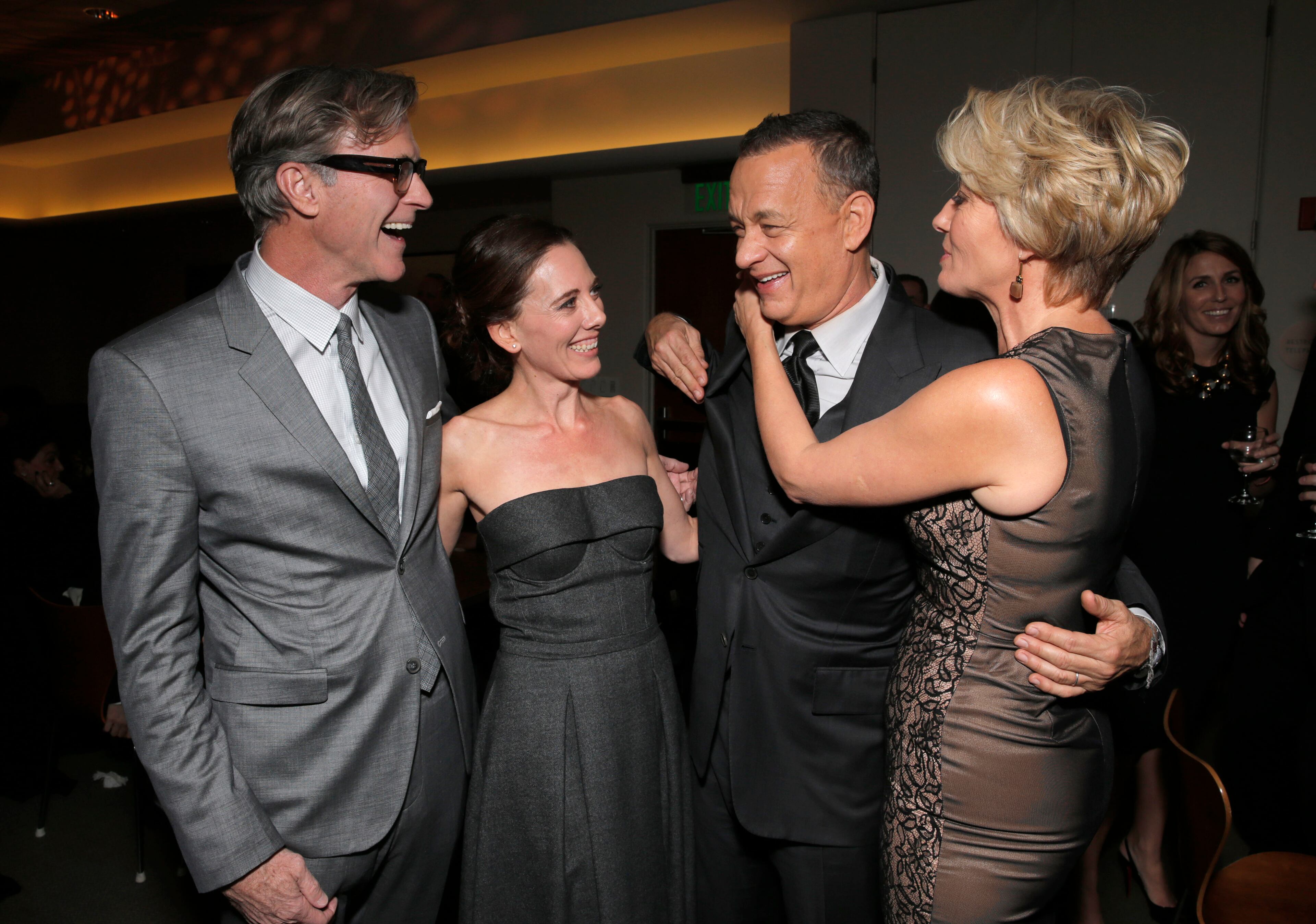 From left, director John Lee Hancock, writer Kelly Marcel, actors Tom Hanks and Emma Thompson attend the after party for the U.S. Premiere of "Saving Mr. Banks", on Monday, December, 9, 2013 in Burbank, Calif. (Photo by Todd Williamson/Invision/AP)