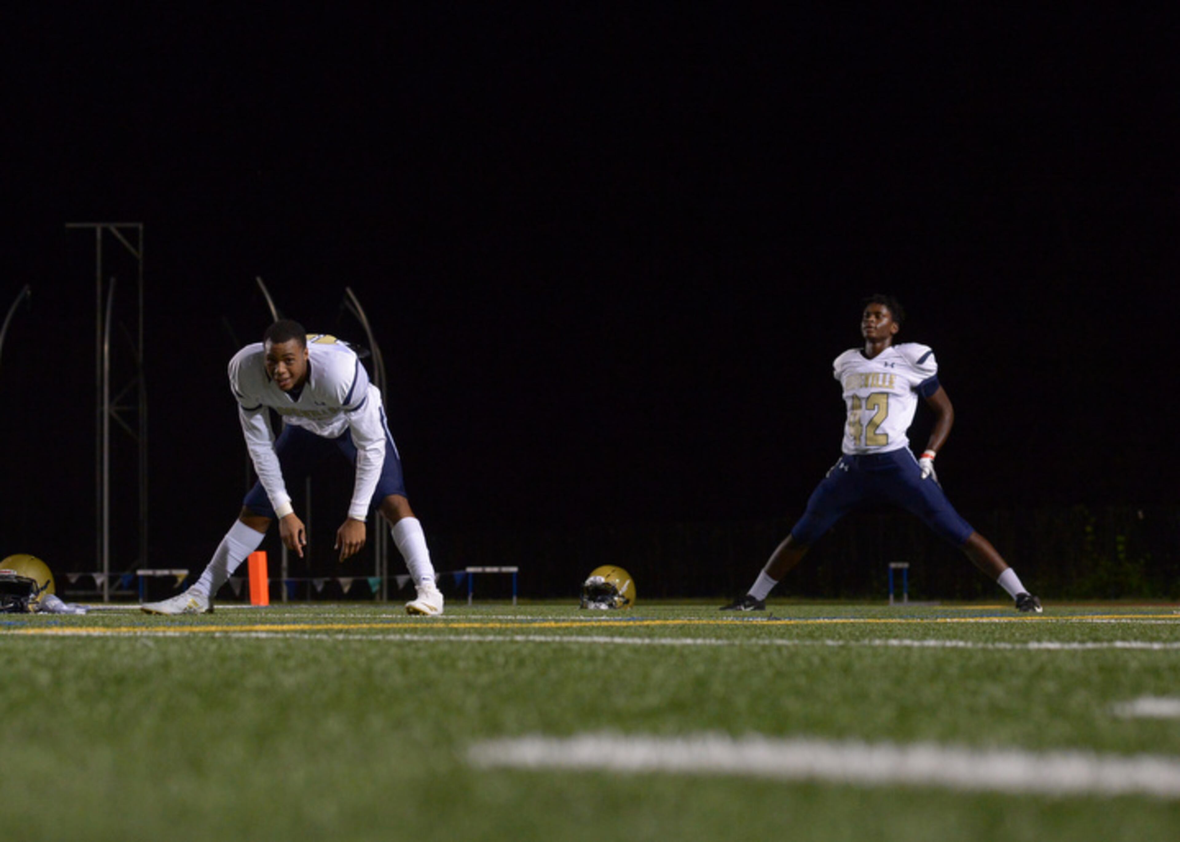 Hapeville Charter players stretch before Friday's game against Douglass at Lakewood Stadium. (Daniel Varnado/Special)