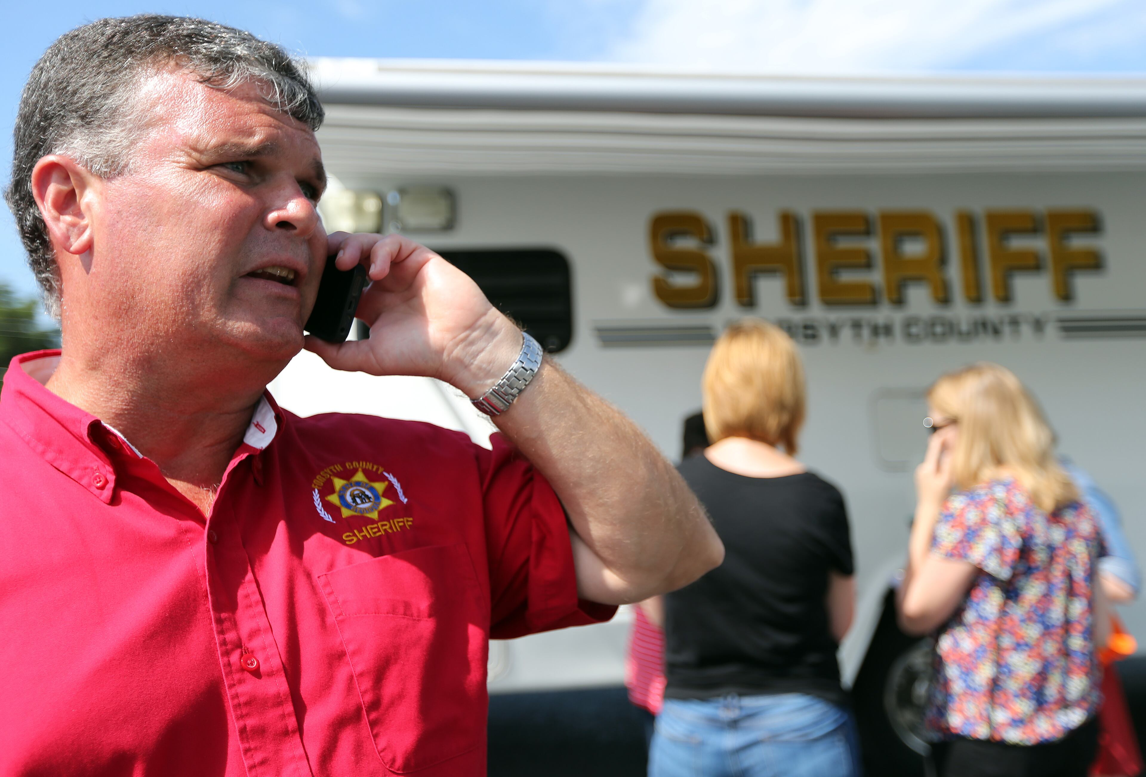 Forsyth County Sheriff Duane Piper talks to a member of the media following a press conference Friday afternoon June 6, 2014 in Cumming following a morning shoot out that left one deputy injured and the perpetrator dead.