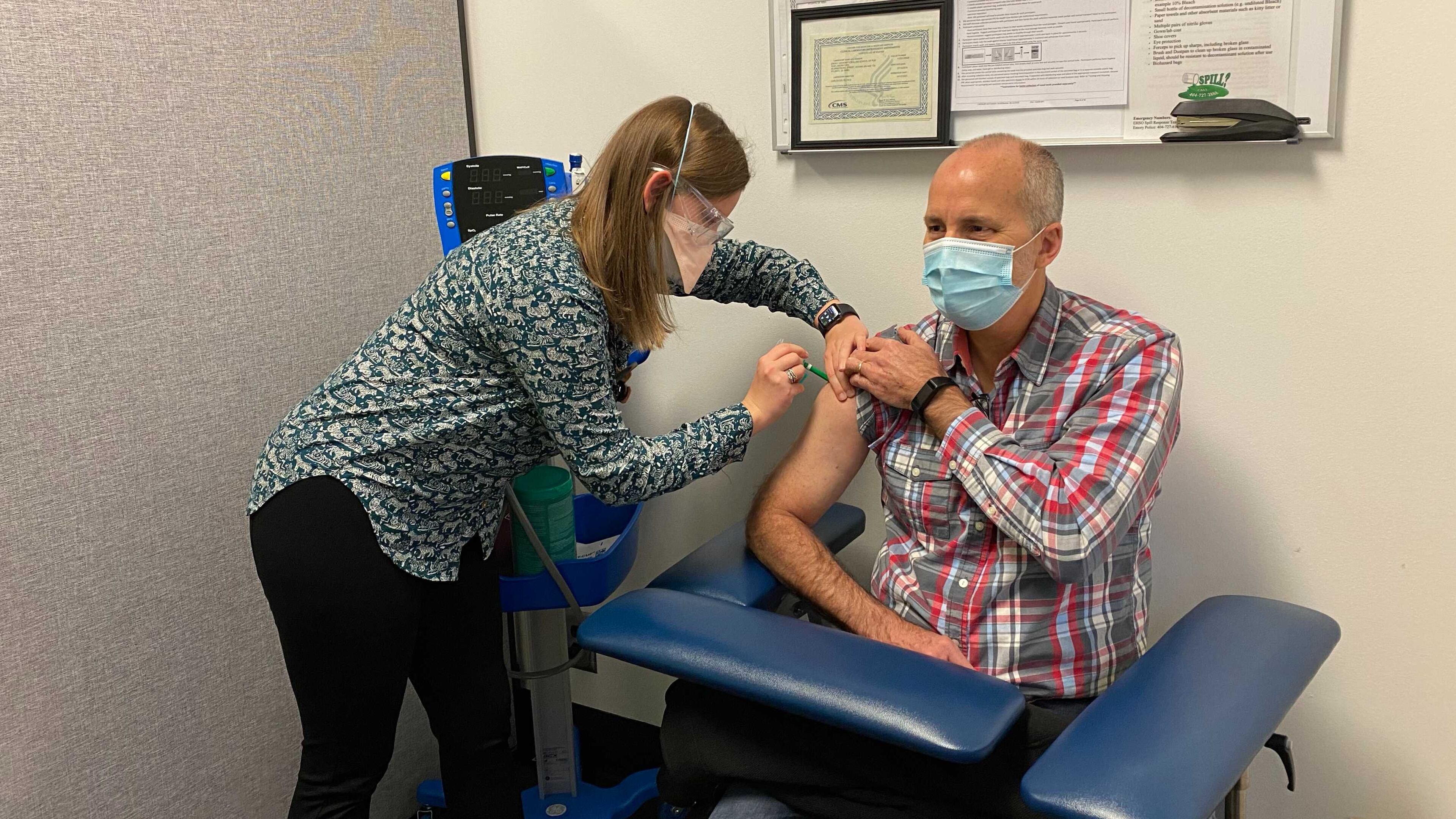 Emory University's Betsy Hall gives a shot to study participant John Arnold for a potential COVID-19 vaccine. Emory is one of several sites nationwide conducting research of a COVID-19 vaccine developed by Novavax, a biotech company based in Maryland. EMORY UNIVERSITY