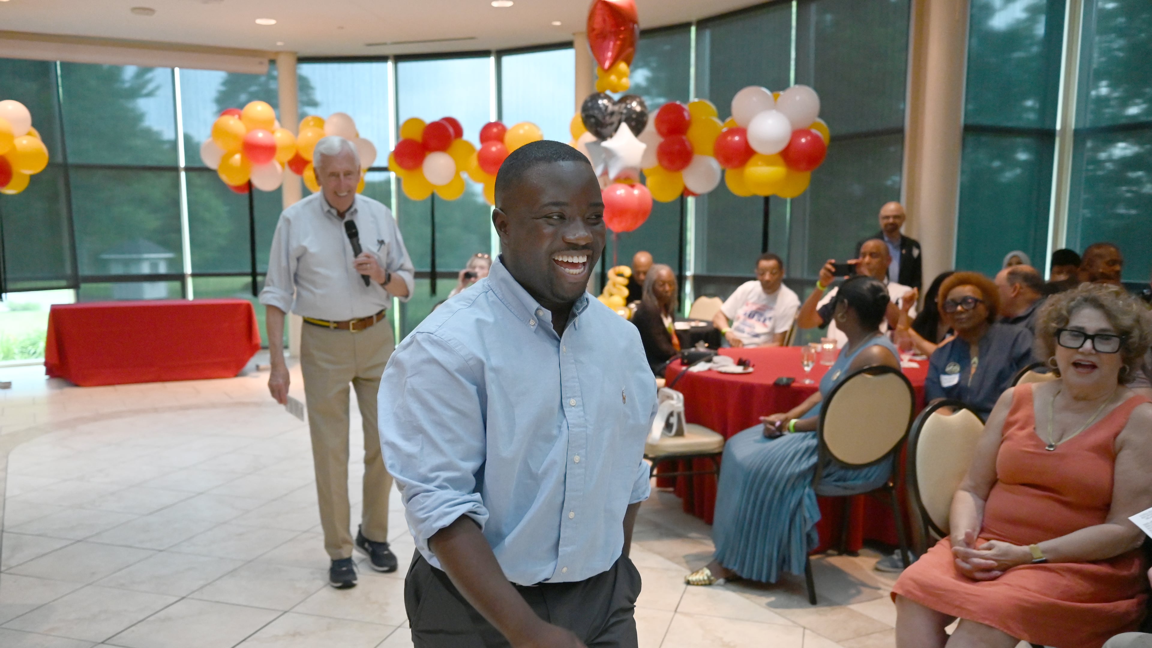 Adrian Boafo, a Maryland state delegate and candidate for U.S. Congress walks into the crowd after being introduced by Congressman Steny Hoyer, left, at the "AmeriPac Bull Roast" Friday, June 12, 2026, in Mitchellville, Md. (AP Photo/Gail Burton)