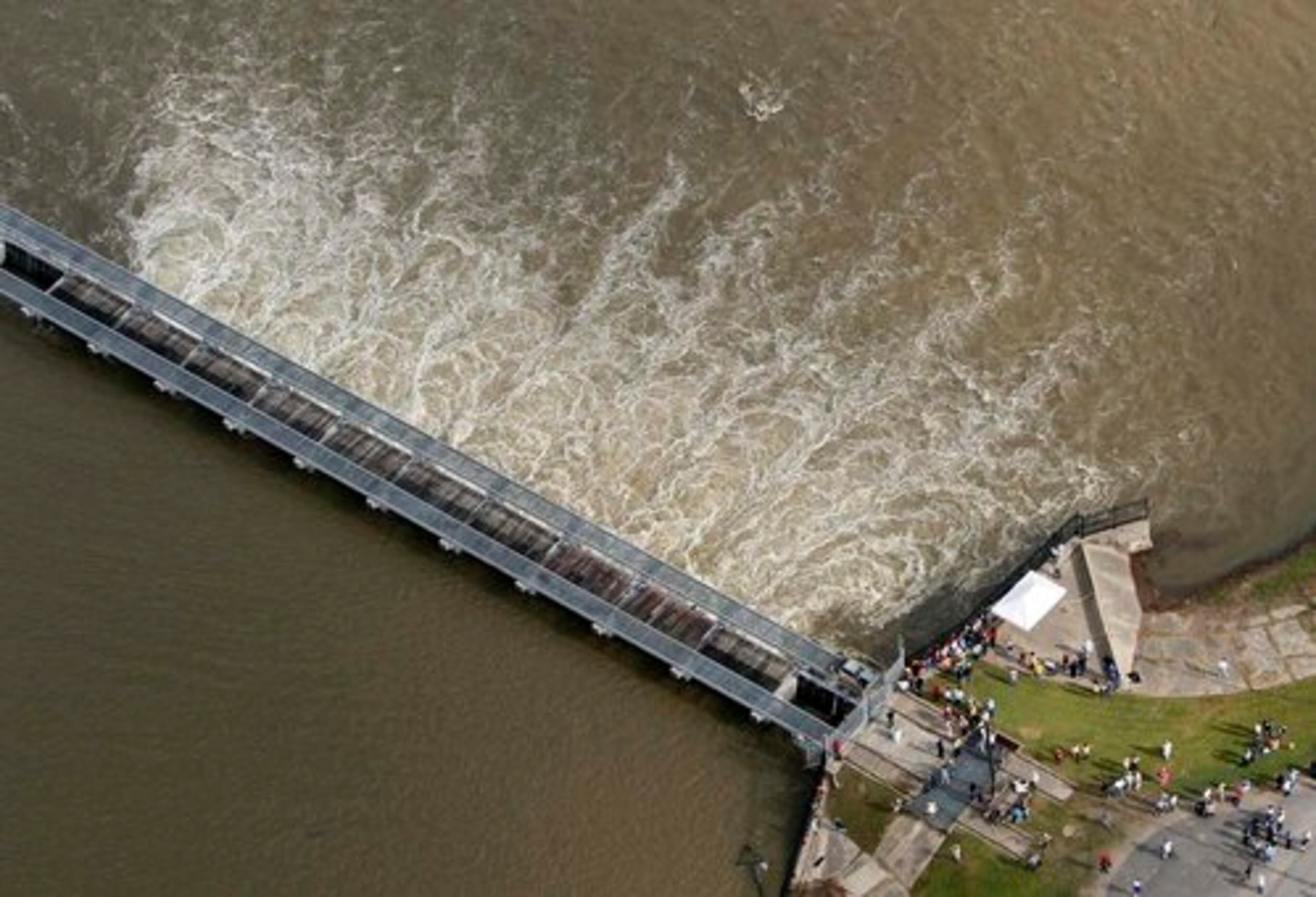 People gather to look at opened bays on the Bonnet Carre Spillway in Norco, La. The spillway, which the Army Corps of Engineers built about 30 miles upriver from New Orleans in response to the great flood of 1927, last opened during the spring 2008. The spillway diverts water from the Mississippi River to Lake Pontchartrain.