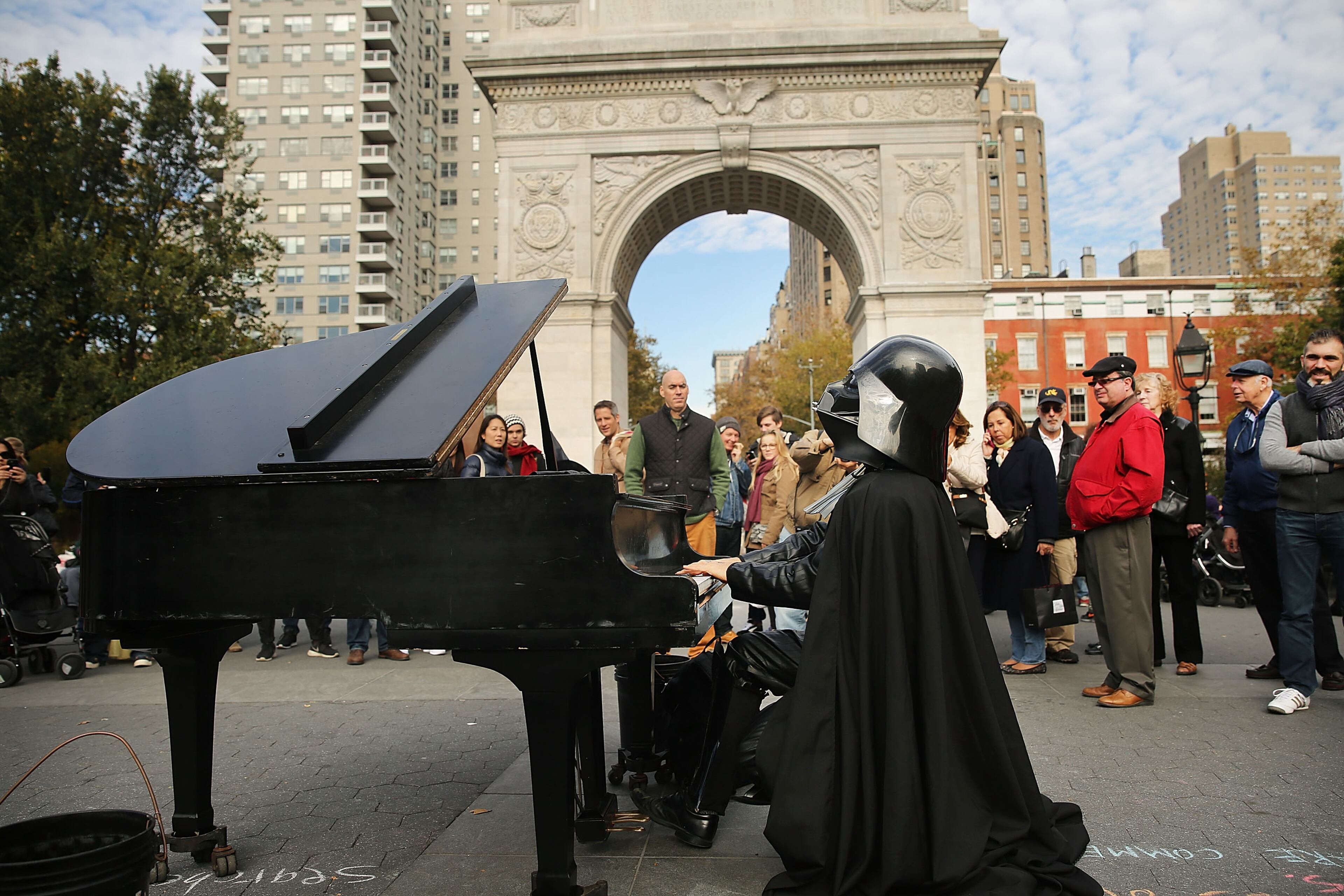 NEW YORK, NY - OCTOBER 31: A man dressed as Darth Vader plays the piano during Halloween festivities in Halloween Washington Square Park on October 31, 2015 in New York City. Thousands of people are descending on New York City's Greenwich Village as it prepares to host the 42nd Annual Village Halloween Parade which has become one of the nation's largest. (Photo by Spencer Platt/Getty Images)