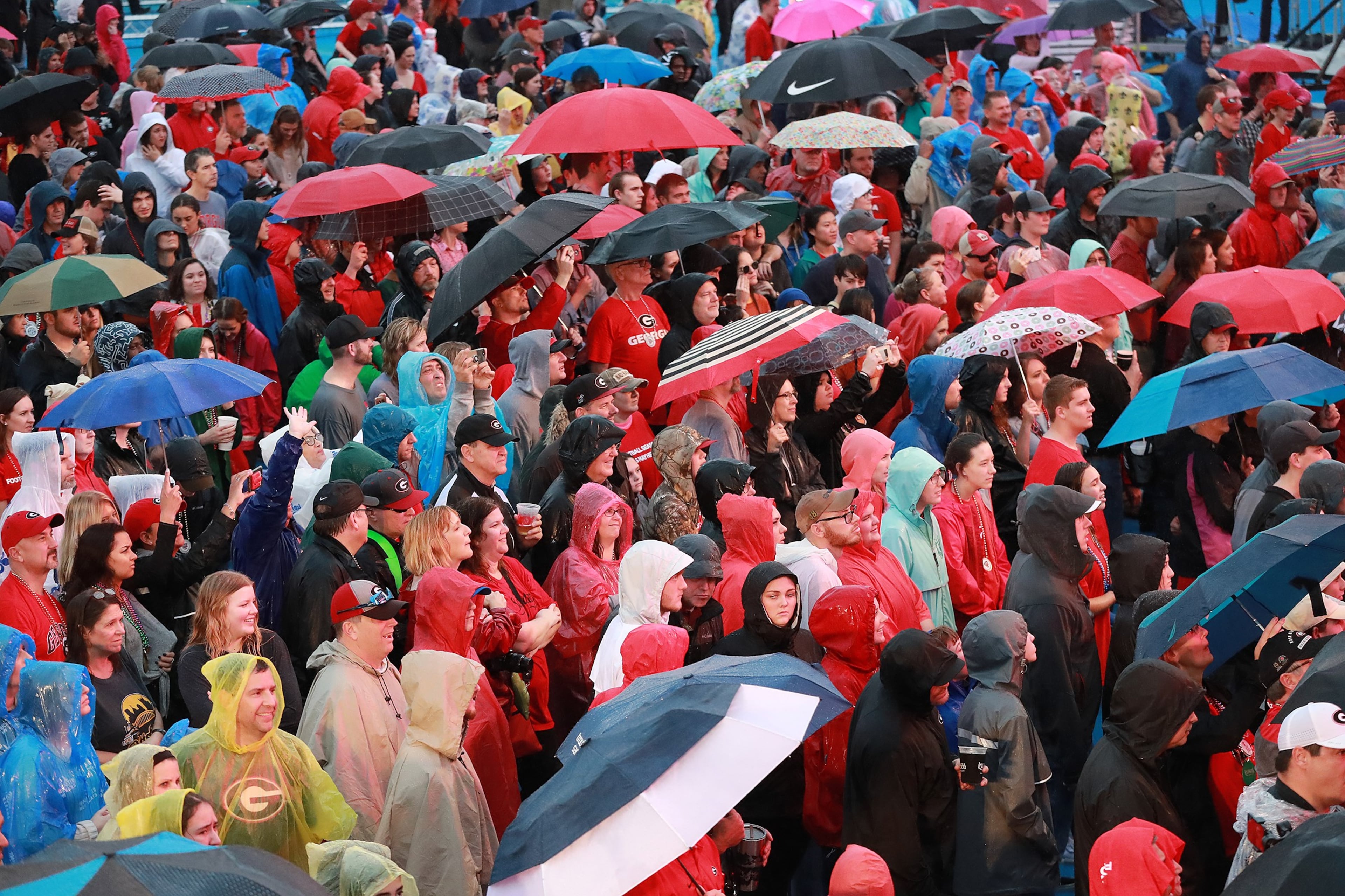 Dec 31, 2018 New Orleans: Georgia fans brave the rain to participate in the Georgia pep rally at the Allstate Fan Fest for the Sugar Bowl on Monday, Dec 31, 2018, in New Orleans. Curtis Compton/ccompton@ajc.com
