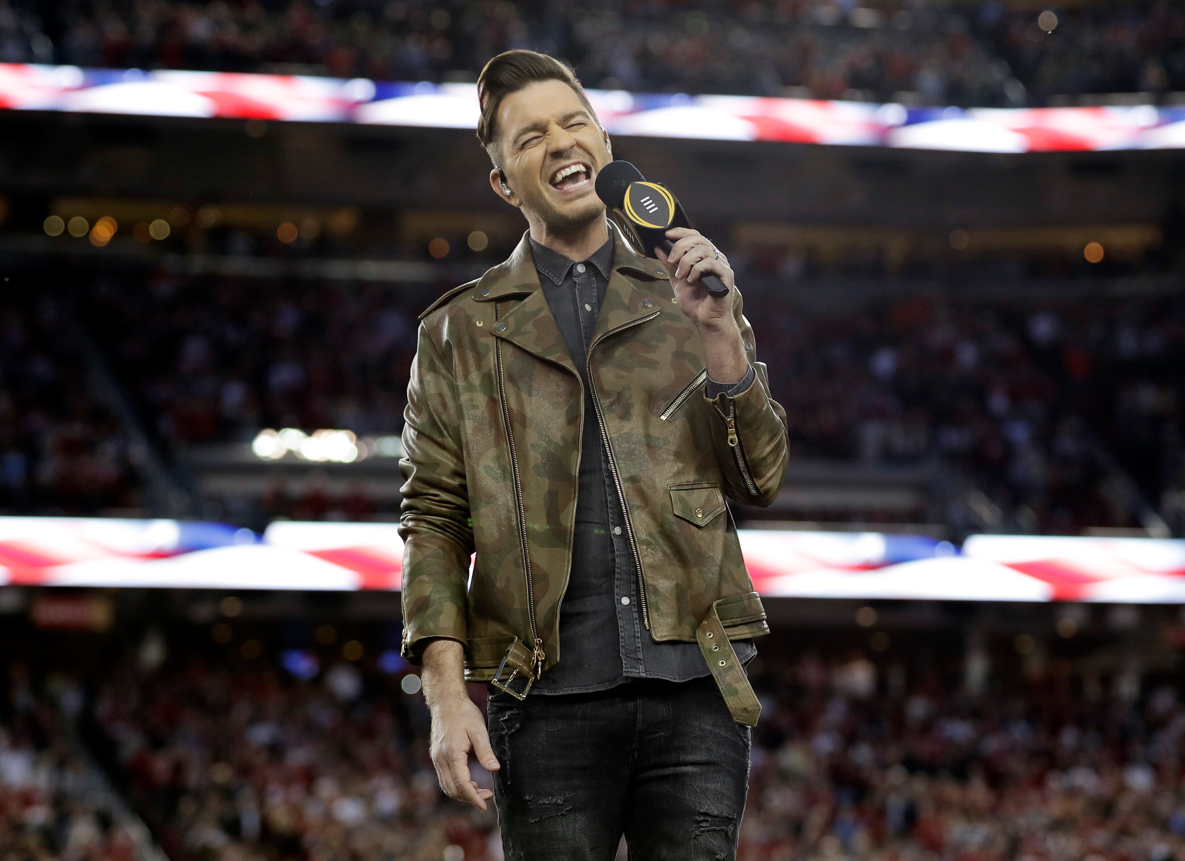 Andy Grammar sings the national anthem before the NCAA college football playoff championship game between Alabama and Clemson Monday, Jan. 7, 2019, in Santa Clara, Calif.