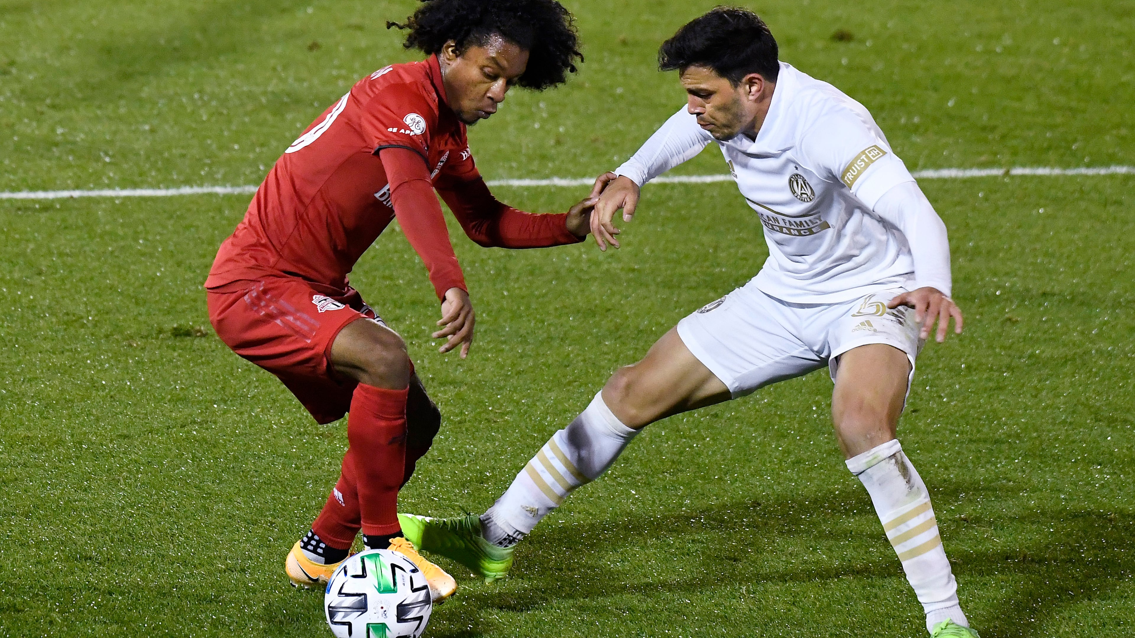 Toronto FC's Jayden Nelson (left) controls the ball as Atlanta United's Fernando Meza defends during the second half Sunday, Oct. 18, 2020, in East Hartford, Conn. (Jessica Hill/AP)