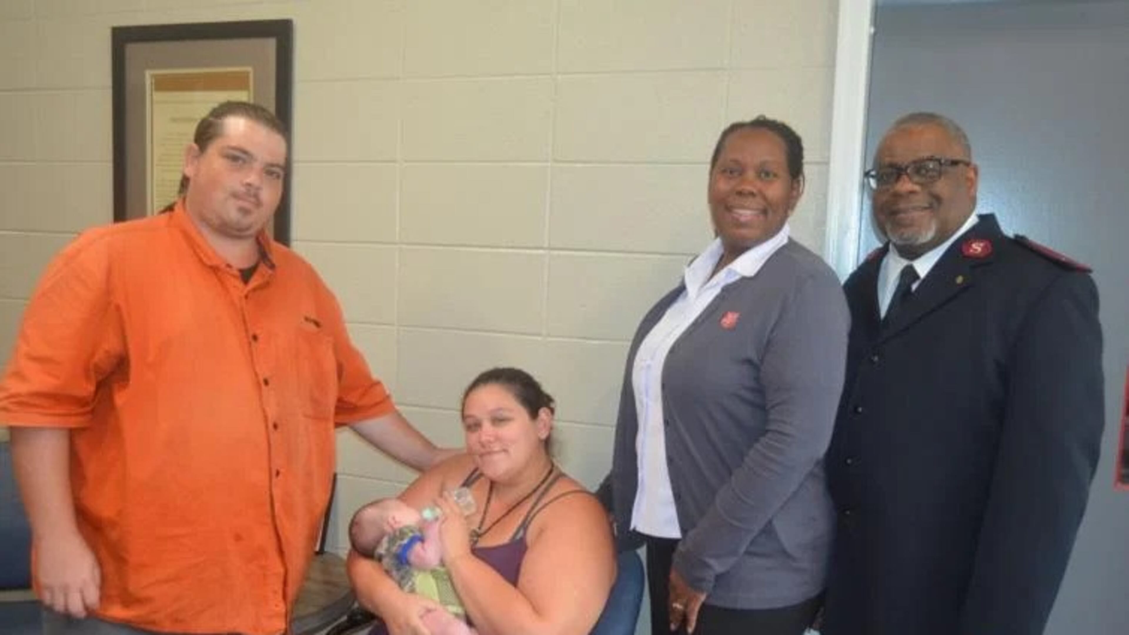 From left, Justin Miller, his wife Britney Miller, holding Baby Rwby, and Salvation Army Capts. Tasha Thomas and Chris Thomas have been caring for the infant since she was born on July 29. It is the first birth for a family staying at the facility while living in one of the recently opened family units at the shelter. (Photo Courtesy of Alan Mauldin)