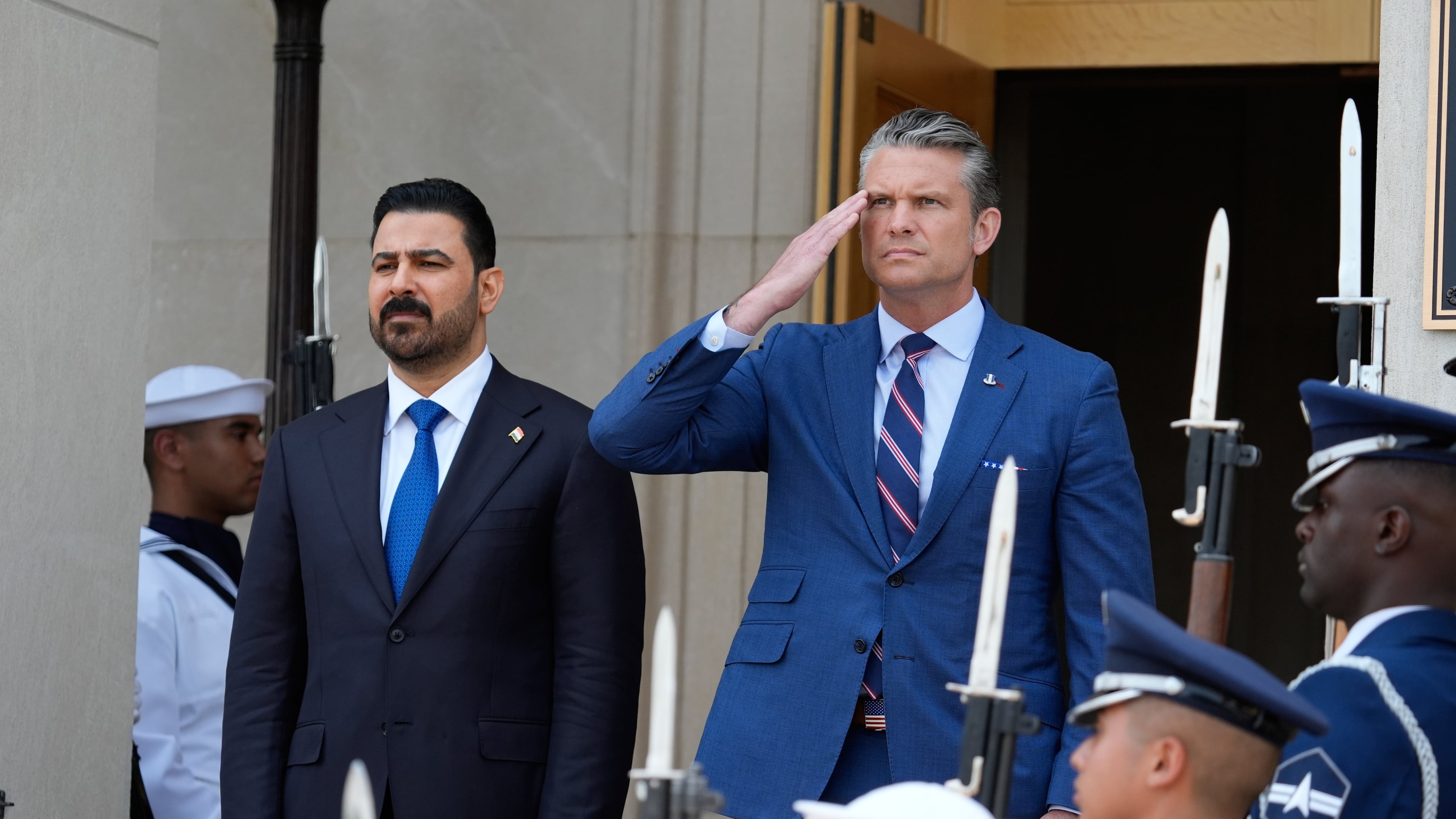 Secretary of Defense Pete Hegseth, right, welcomes Iraqi Prime Minister Ali al-Zaidi, to the Pentagon, during a ceremony, Tuesday, July 14, 2026, in Washington. (AP Photo/Manuel Balce Ceneta)