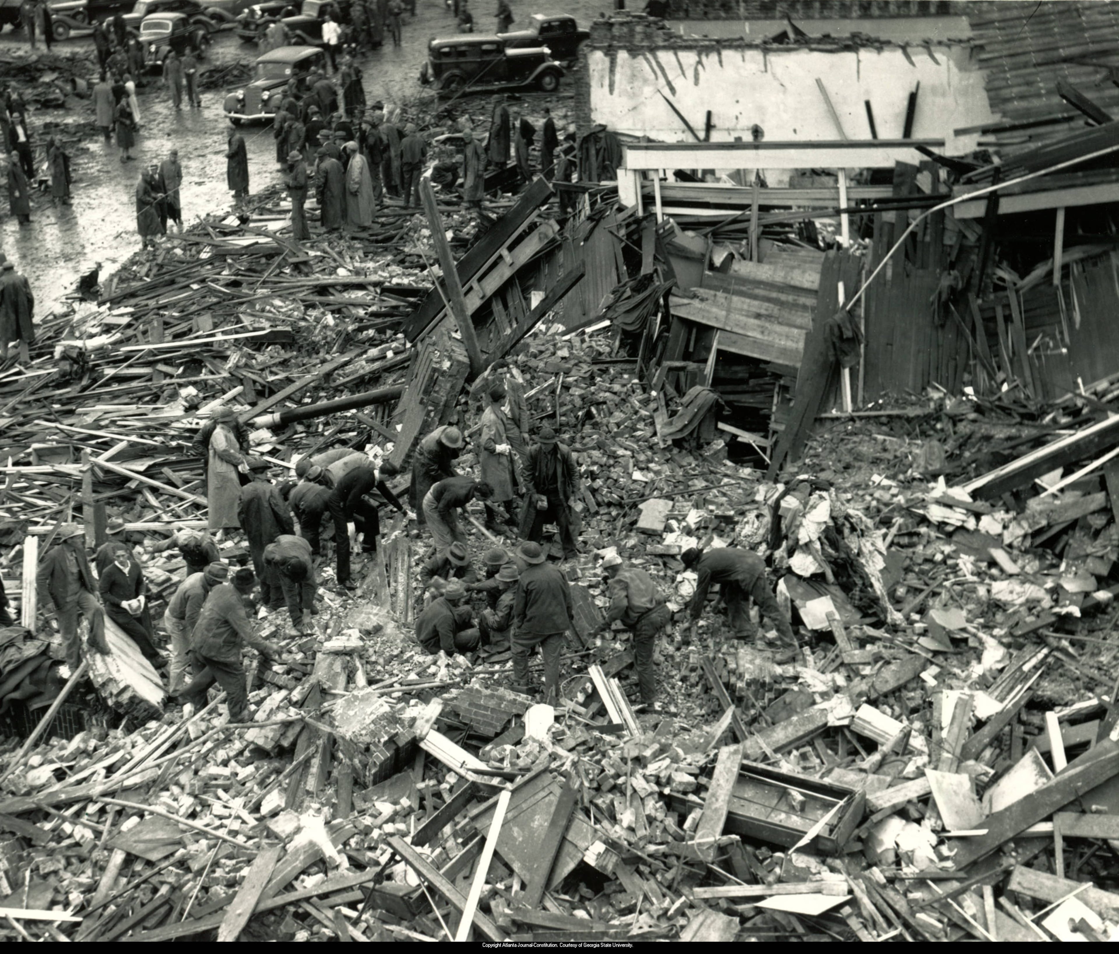 Original photo caption: "April 6, 1936 -- The ruins of a downtown Gainesville, Ga. garment factory where many died when a roaring tornado took at least 43 lives. Much of the business section, and some residential areas, in an area two and a half miles long and half a mile wide, were ravaged by the storm."